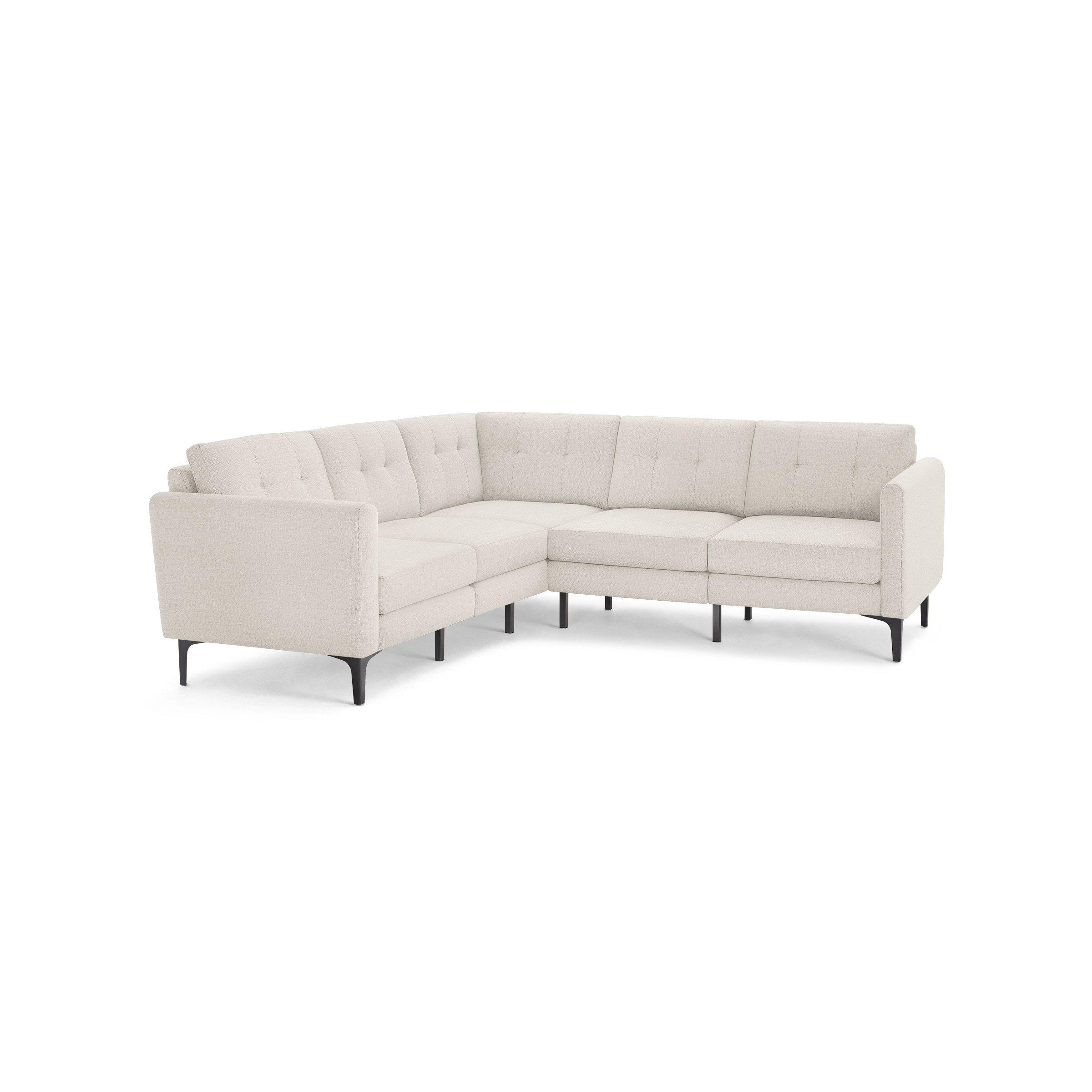Beige L-shaped sectional sofa with tufted back cushions, slim black legs, and modern, minimalist design.