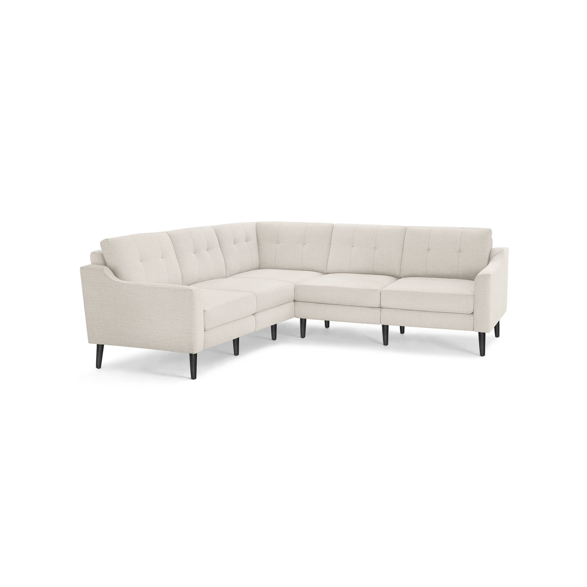 Beige fabric L-shaped sectional sofa with tufted back cushions and slim black tapered legs.
