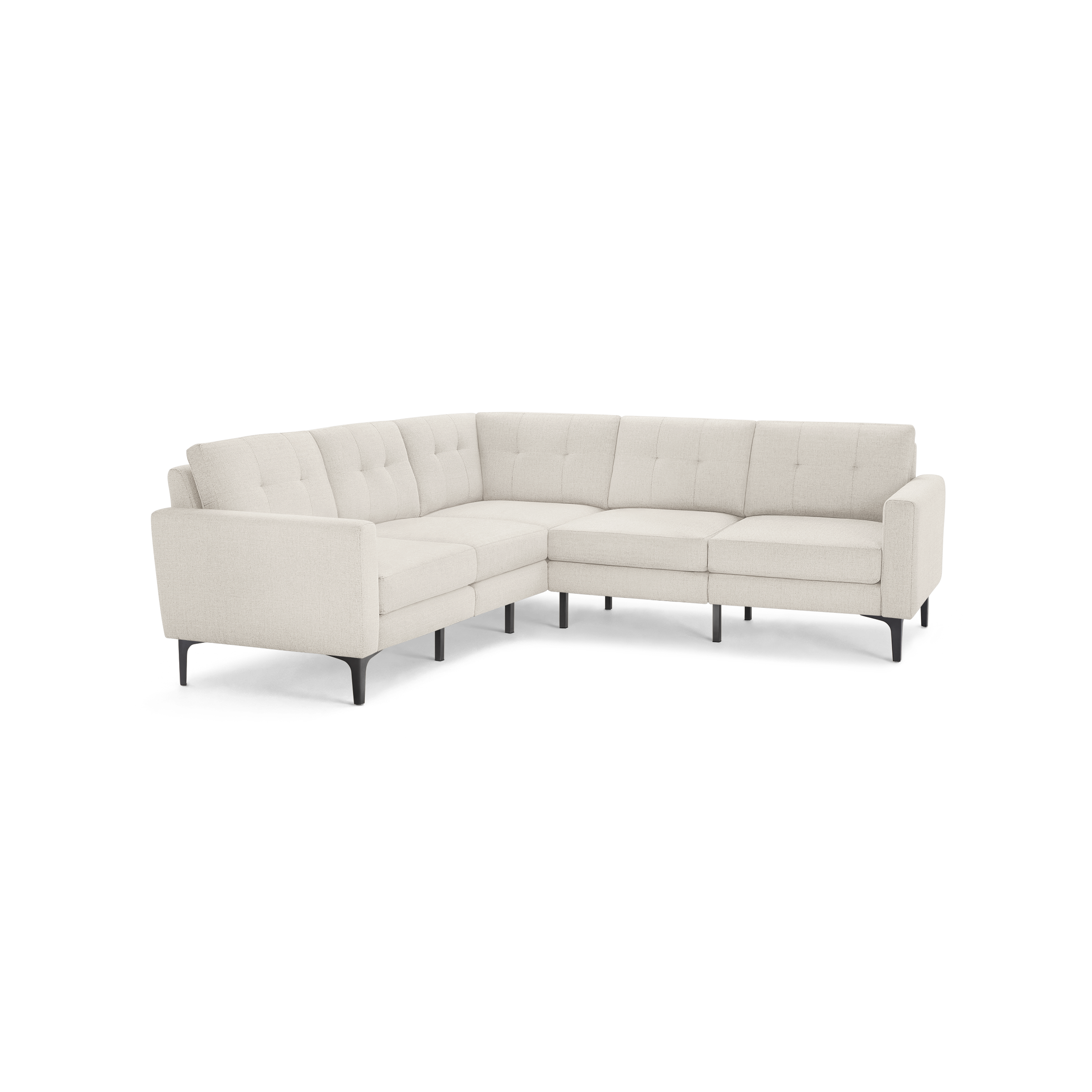 Light beige L-shaped sectional sofa with tufted back cushions and slim black legs, designed for modern living spaces.