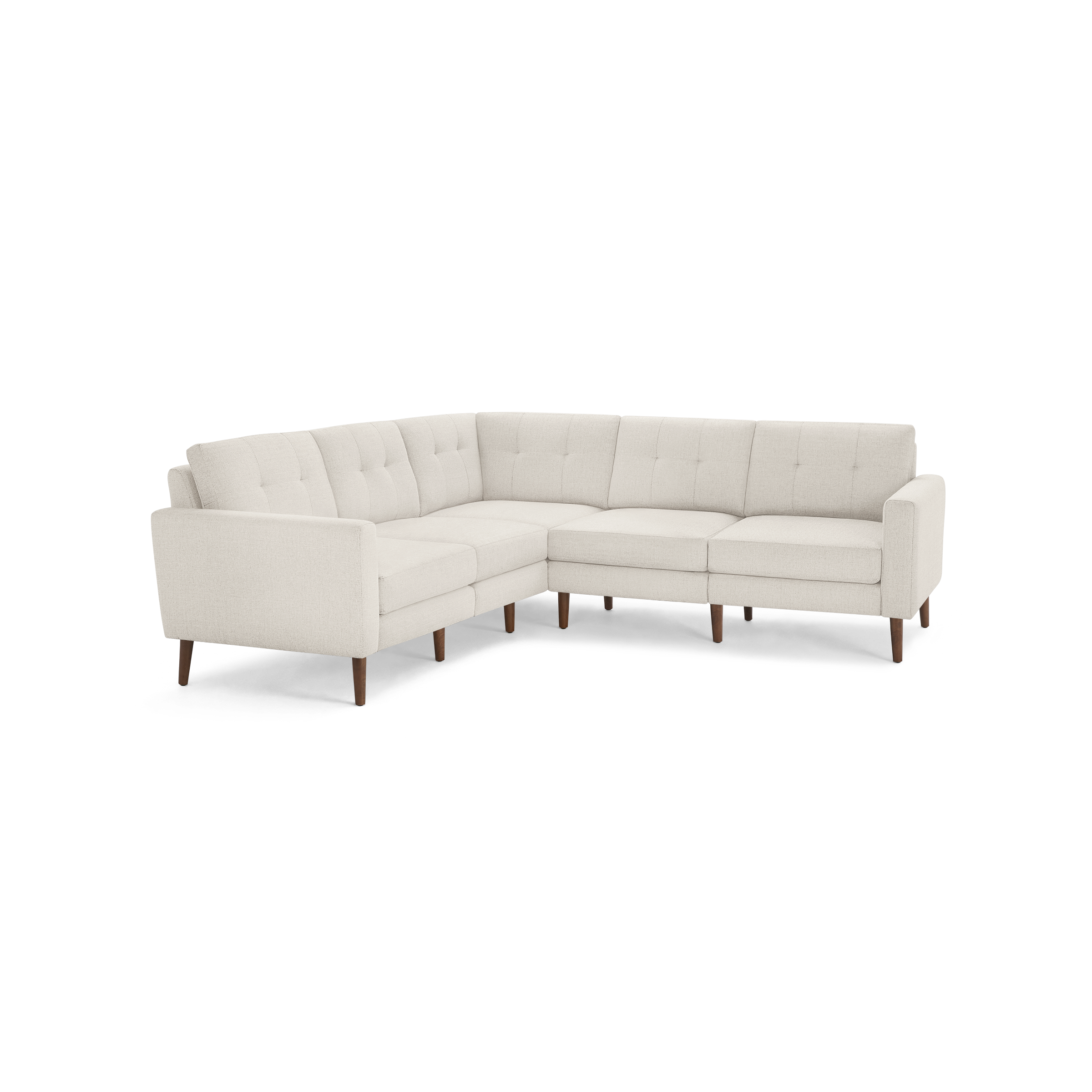Light beige L-shaped sectional sofa with tufted back cushions and wooden tapered legs, modern mid-century design.