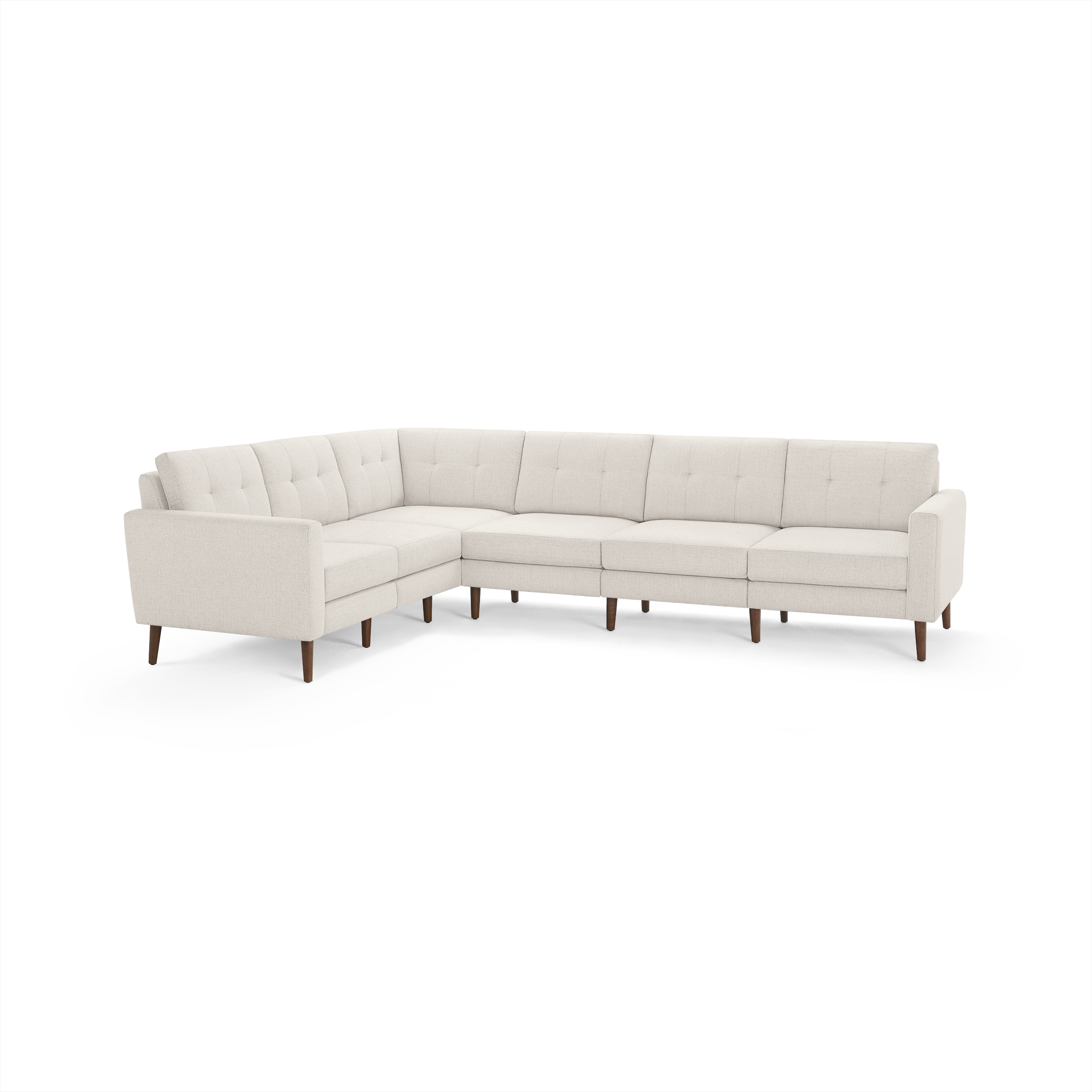 Cream-colored L-shaped sectional sofa with tufted back cushions and wooden legs on a white background.