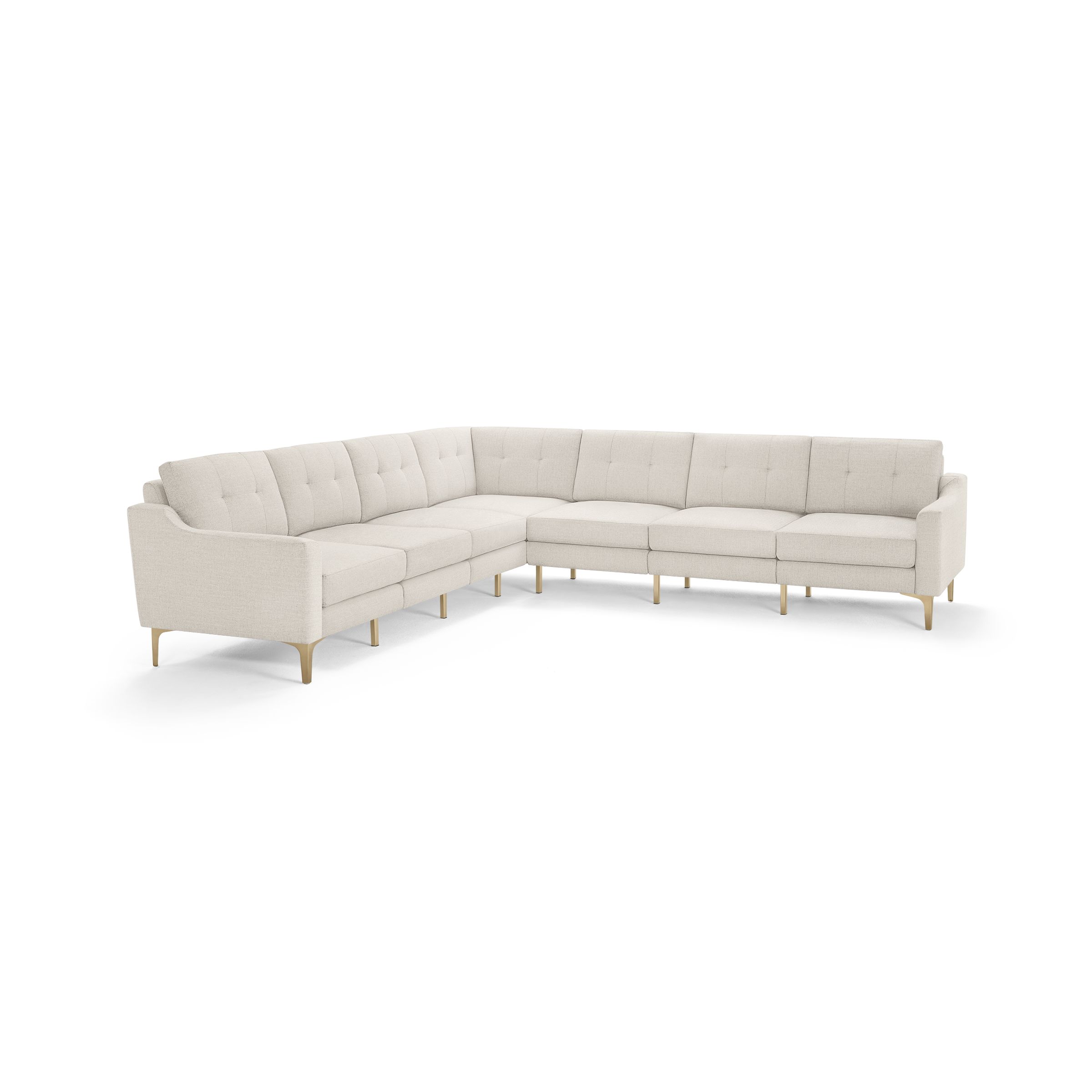 Large L-shaped sectional sofa with light beige tufted cushions, wooden legs, and low armrests, designed for modern living rooms.