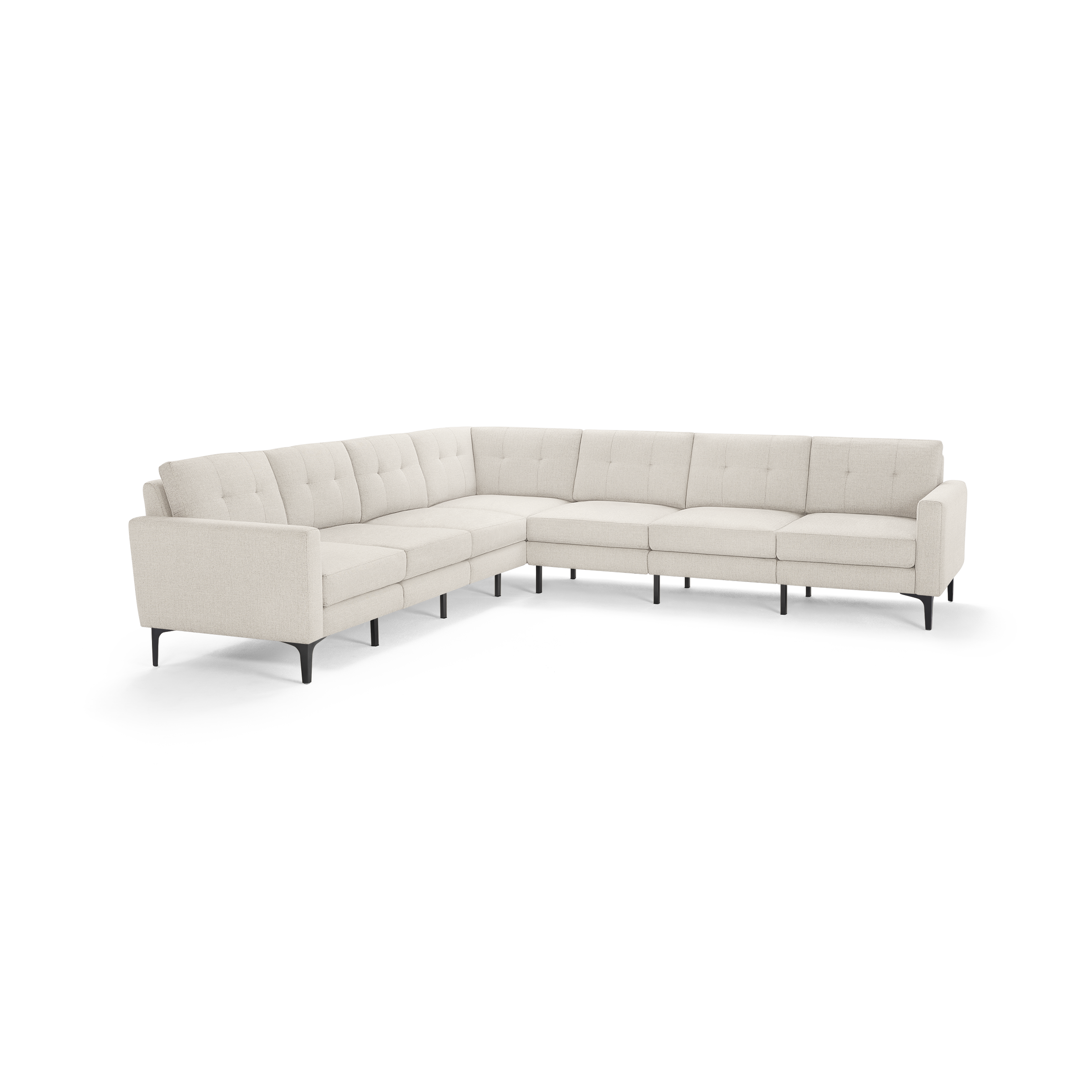 Large modern L-shaped sectional sofa with light beige upholstery, tufted back cushions, slim black metal legs, and clean lines.