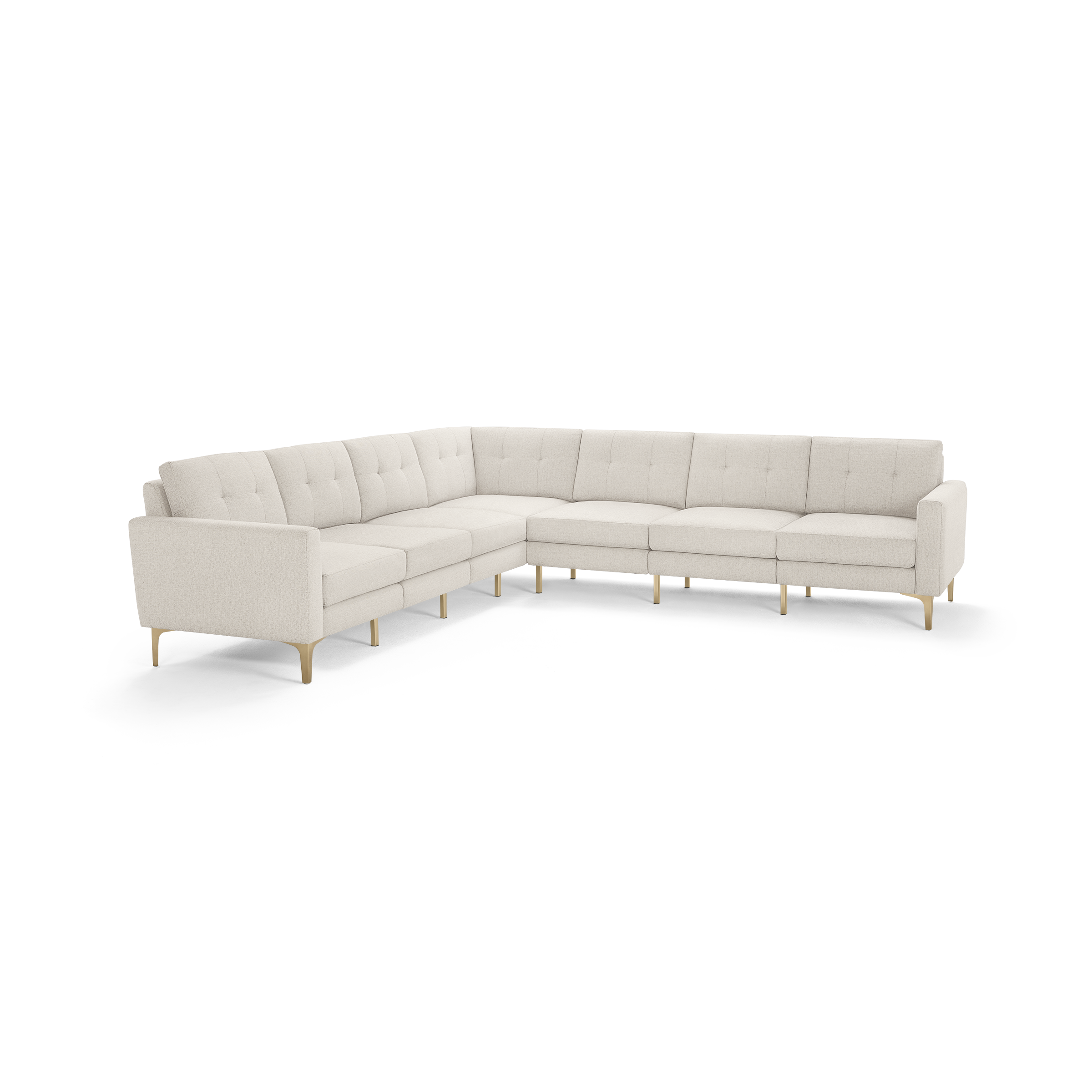 Large modern L-shaped sectional sofa with light beige tufted fabric upholstery and slim wooden legs.