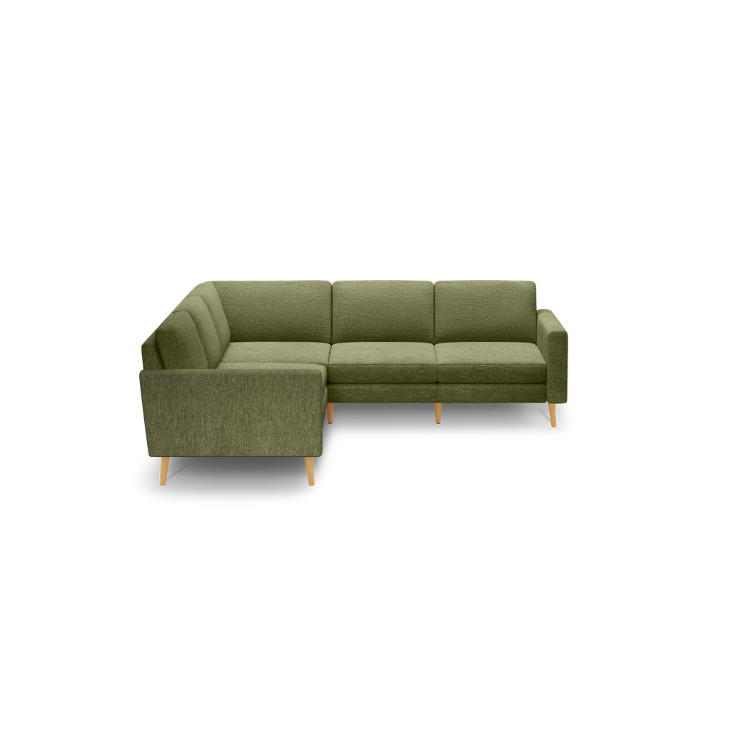 Modern olive green L-shaped sectional sofa with soft fabric upholstery and light wooden legs, featuring cushioned seats and backrests for comfort.