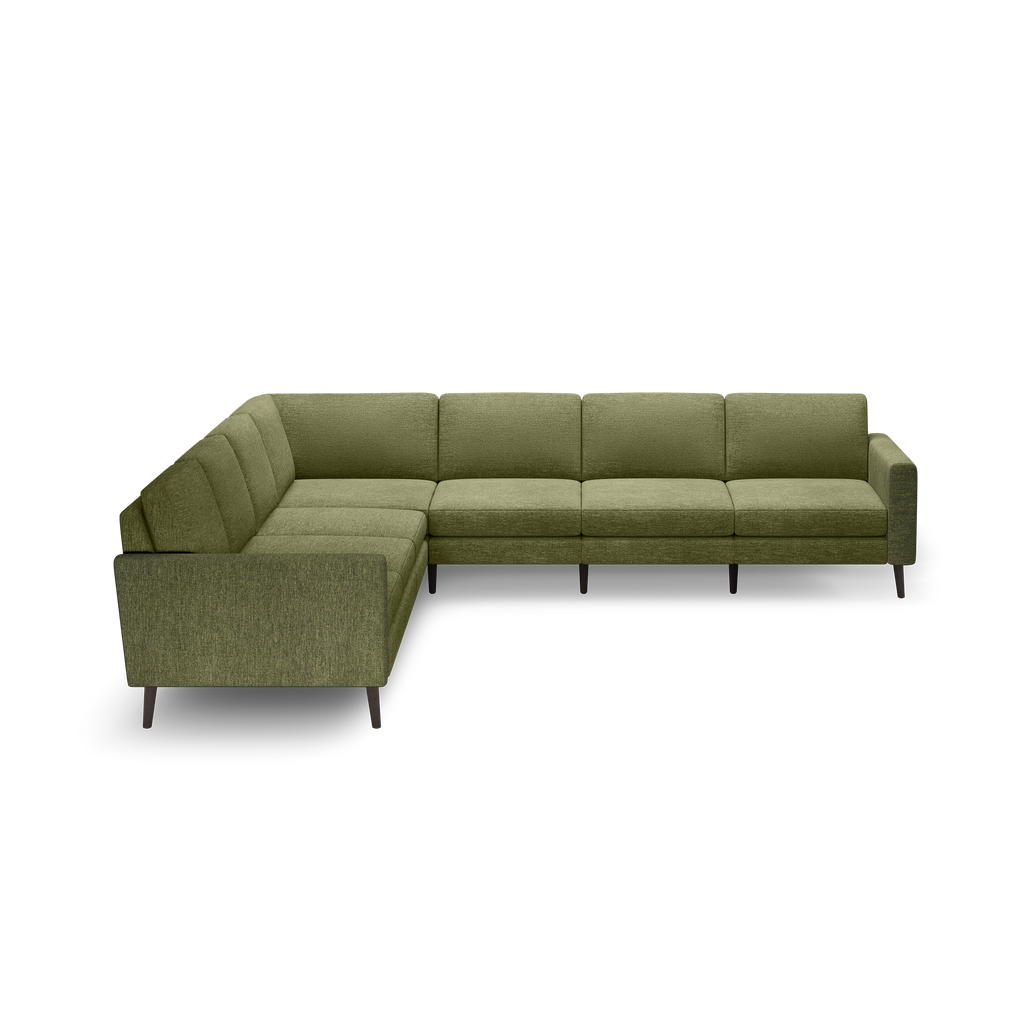 L-shaped sectional sofa in olive green fabric with tufted cushions and dark wooden legs on a black background.