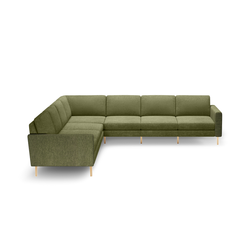 Olive green L-shaped sectional sofa with tufted cushions and light wooden legs, modern design, spacious seating for multiple people.