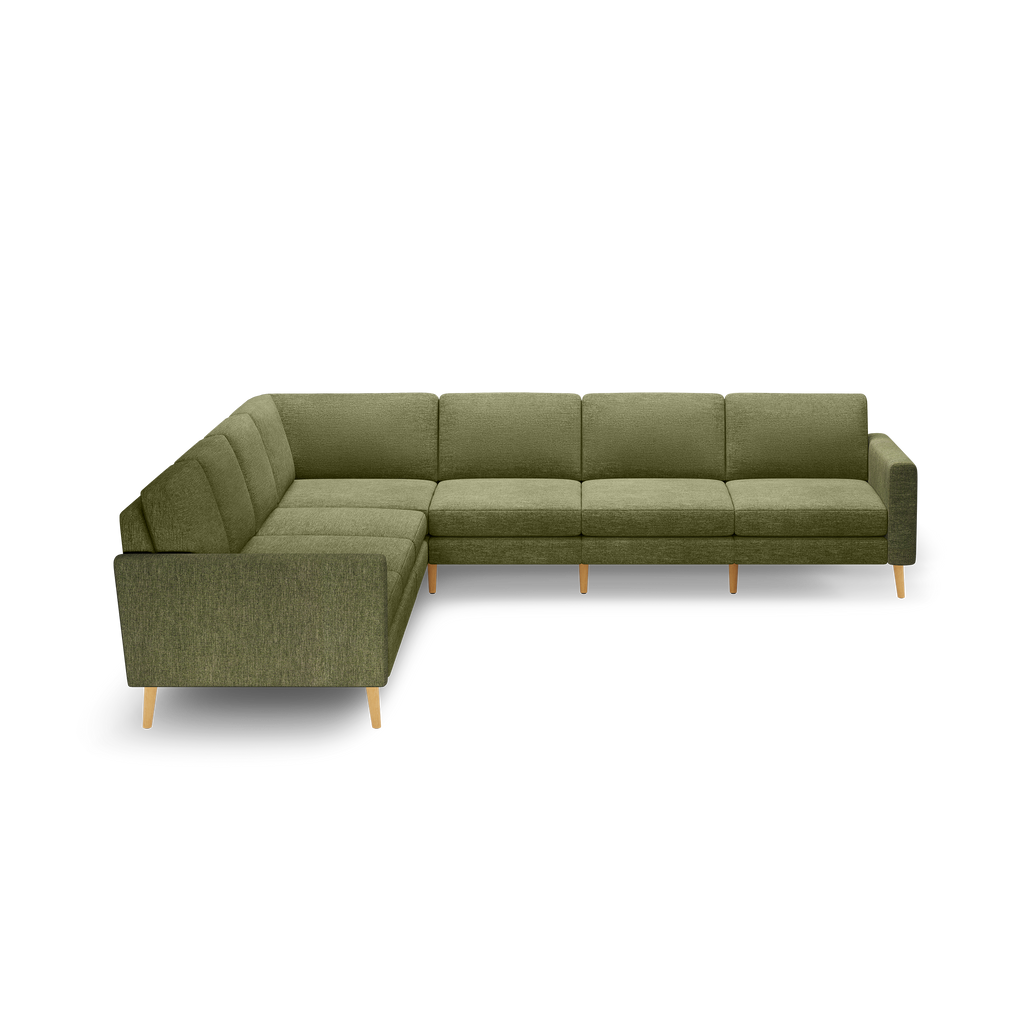 L-shaped sectional sofa in olive green fabric with tufted cushions and light wooden legs, featuring clean modern lines.