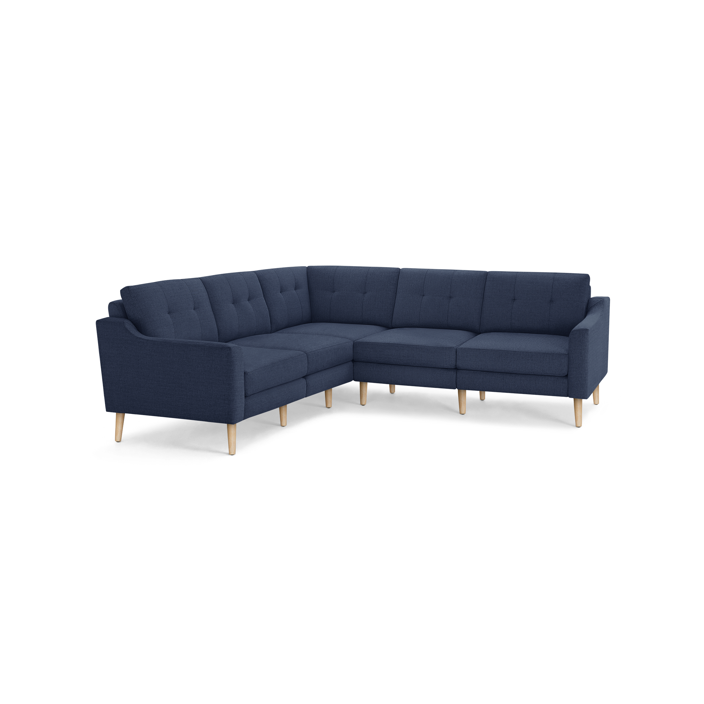 L-shaped sectional sofa with tufted navy blue fabric cushions and light wooden legs, featuring clean lines and mid-century modern design.