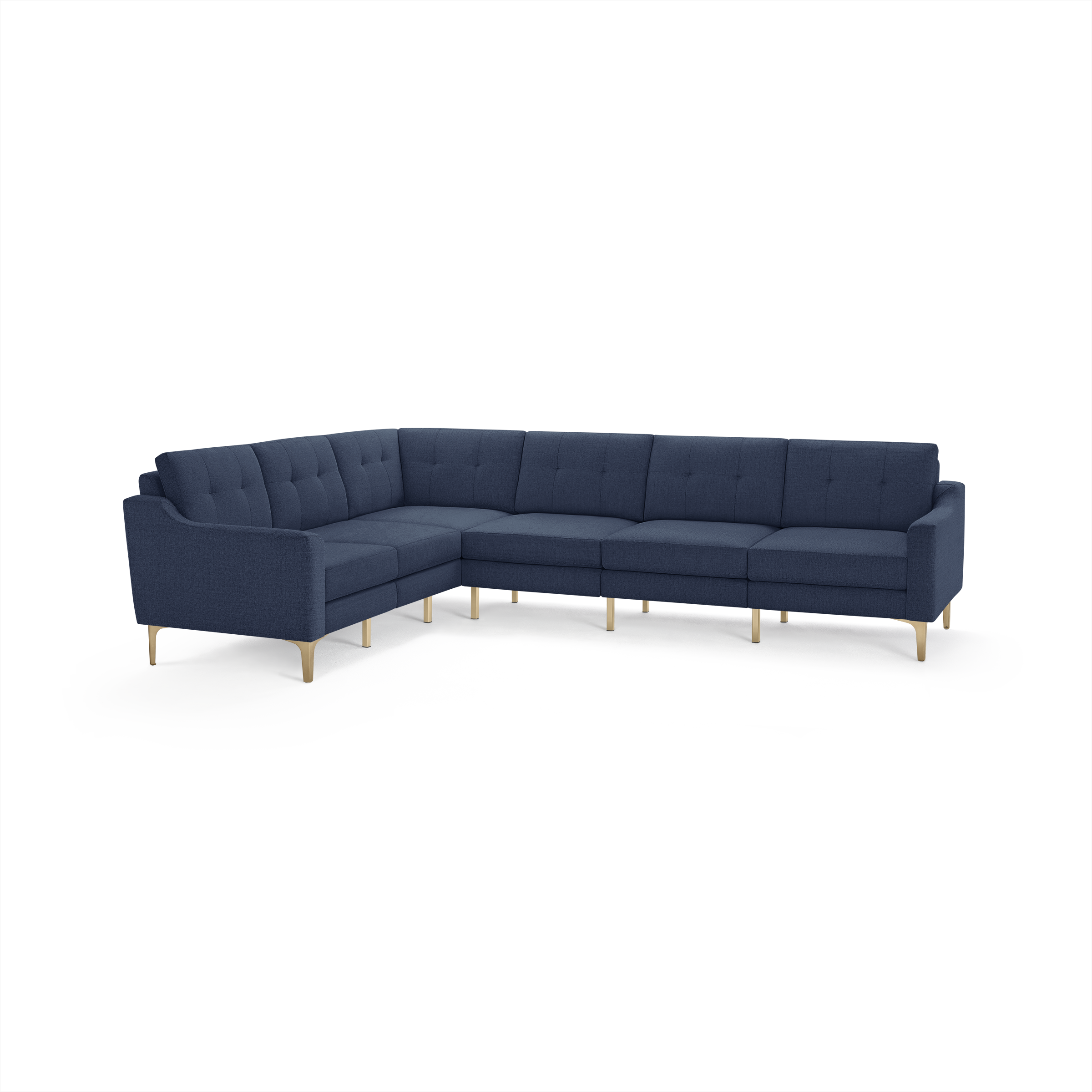 Large L-shaped sectional sofa upholstered in dark blue fabric with tufted back cushions and light wood legs.