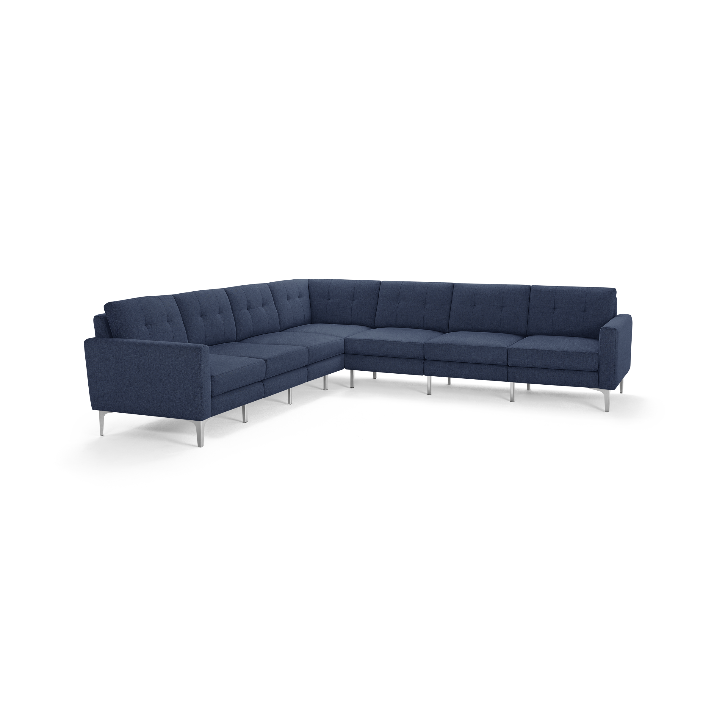 Large L-shaped sectional sofa in navy blue fabric with tufted cushions and thin silver metal legs.