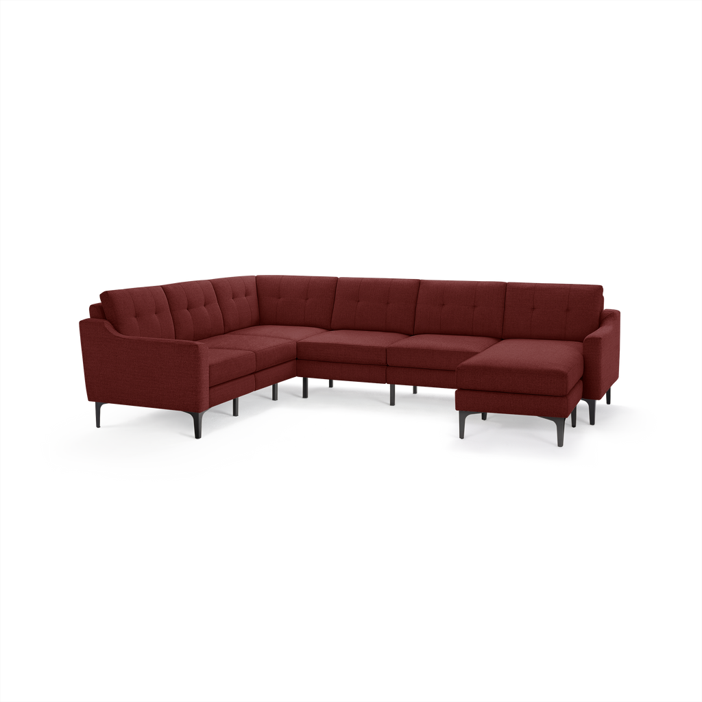 Modern large L-shaped sectional sofa in deep burgundy fabric with tufted backrest and black metal legs.