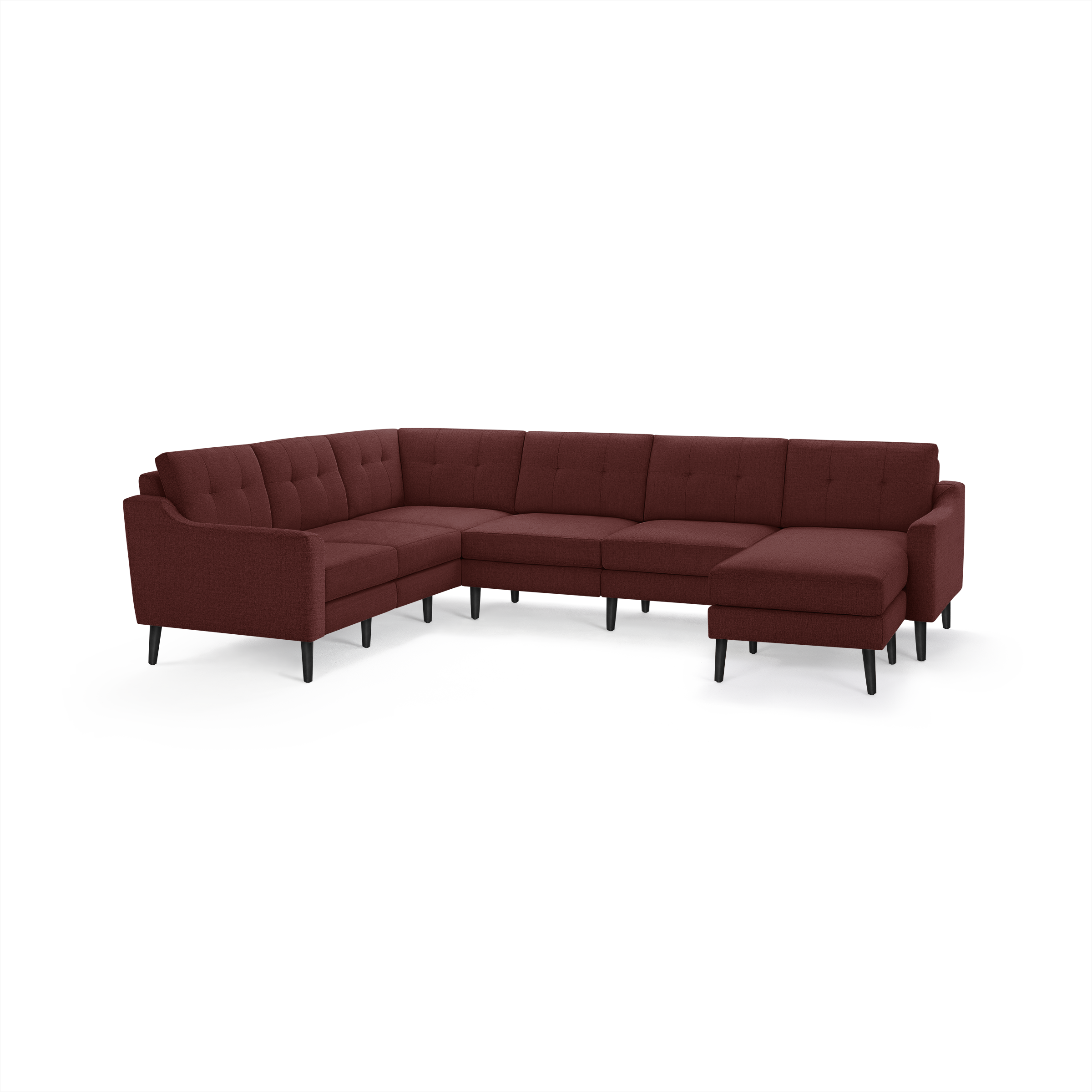 Large modern L-shaped sectional sofa in deep red fabric with tufted back cushions and black tapered legs.