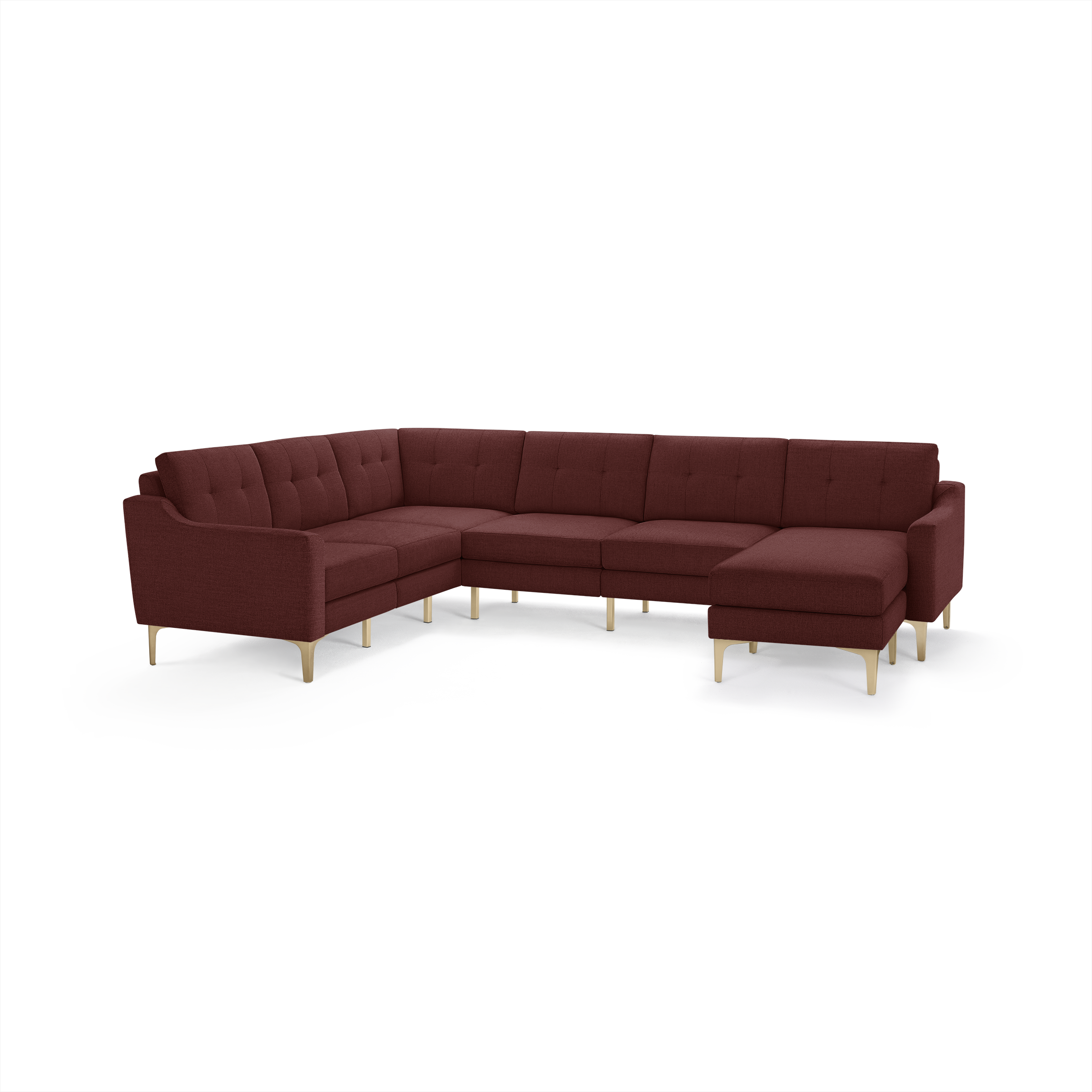 Large L-shaped sectional sofa with tufted back cushions, deep red fabric upholstery, and light wooden legs.
