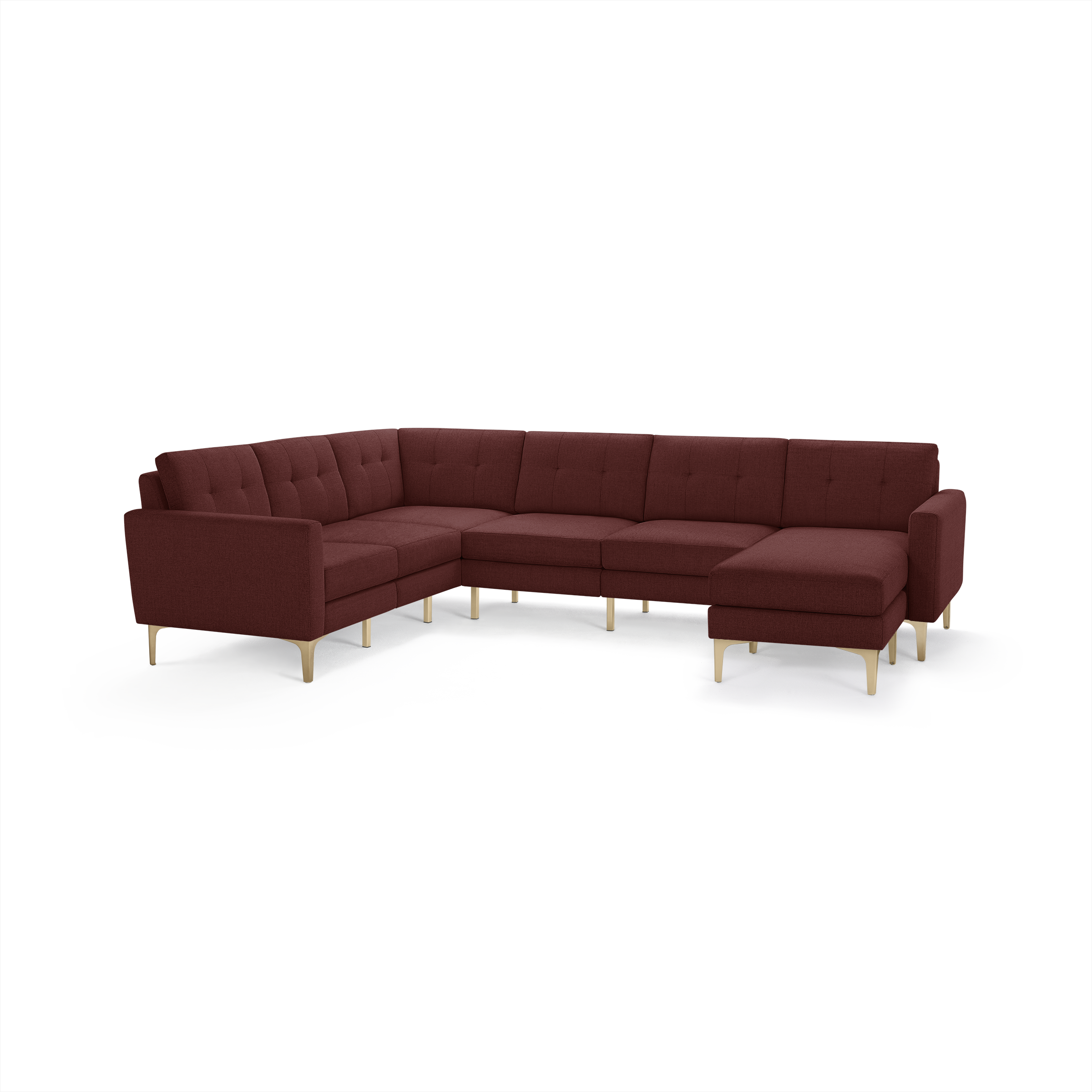 Modern L-shaped sectional sofa in deep burgundy fabric with tufted cushions and light wooden legs.