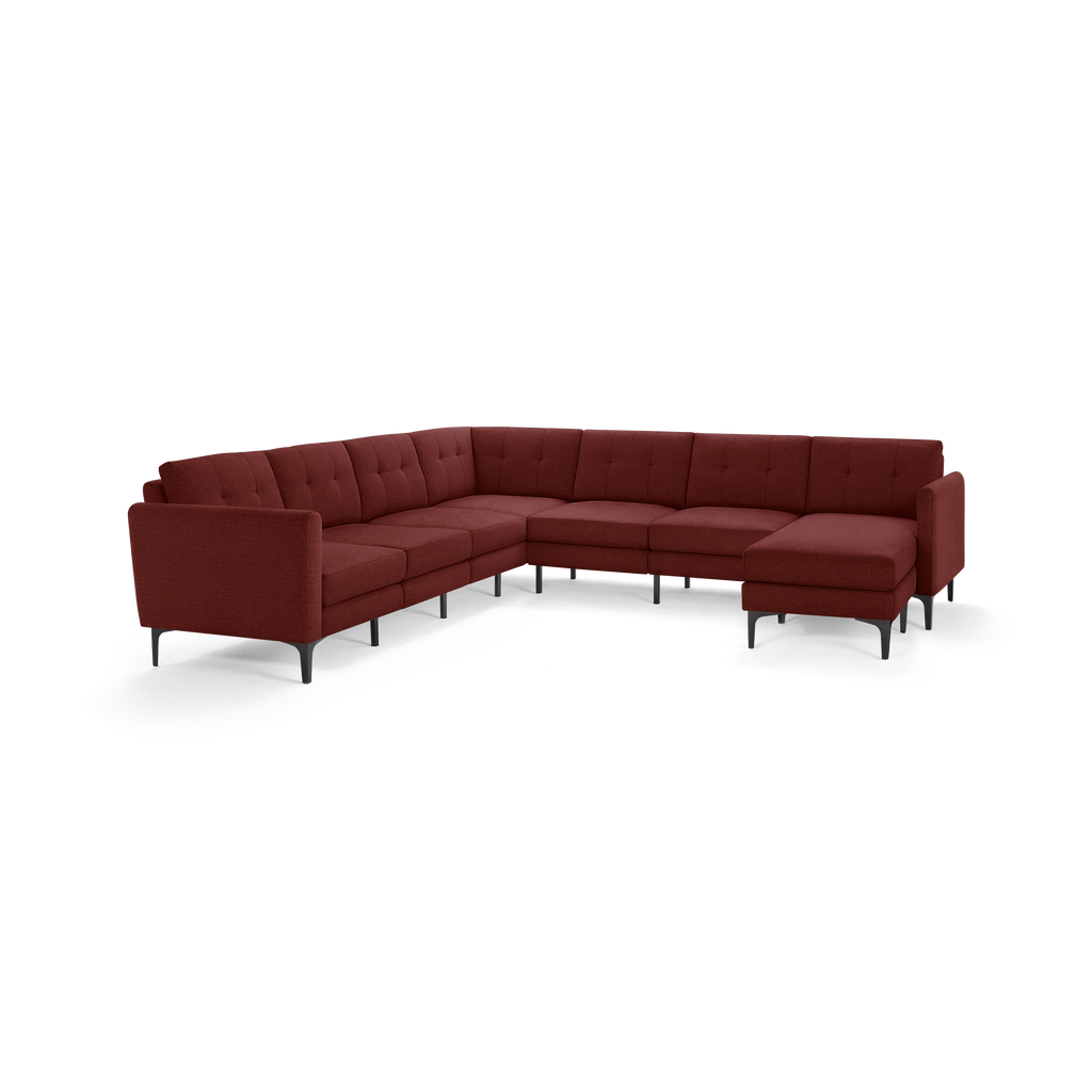 Modern L-shaped sectional sofa upholstered in deep red fabric with tufted cushions and black metal legs, offering ample seating and comfort.