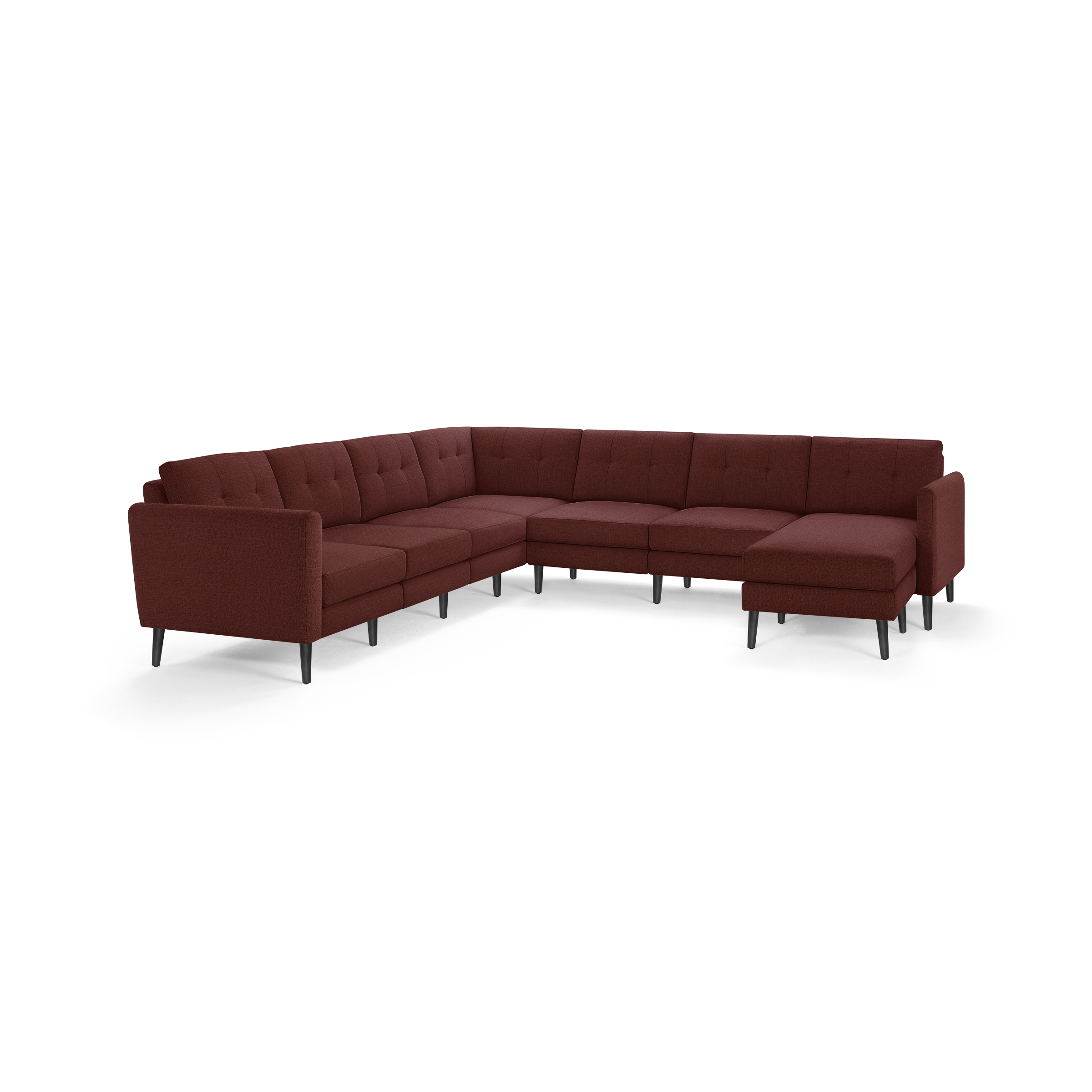Modern L-shaped sectional sofa in dark red fabric with tufted cushions and slim black legs, offering ample seating space.