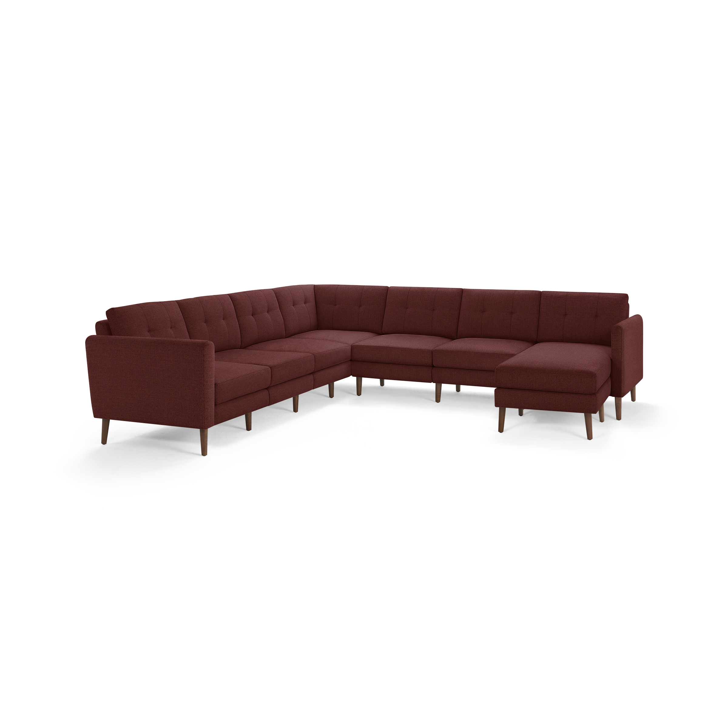 Large L-shaped sectional sofa with deep red fabric upholstery, tufted back cushions, and wooden legs, designed for ample seating and comfort.