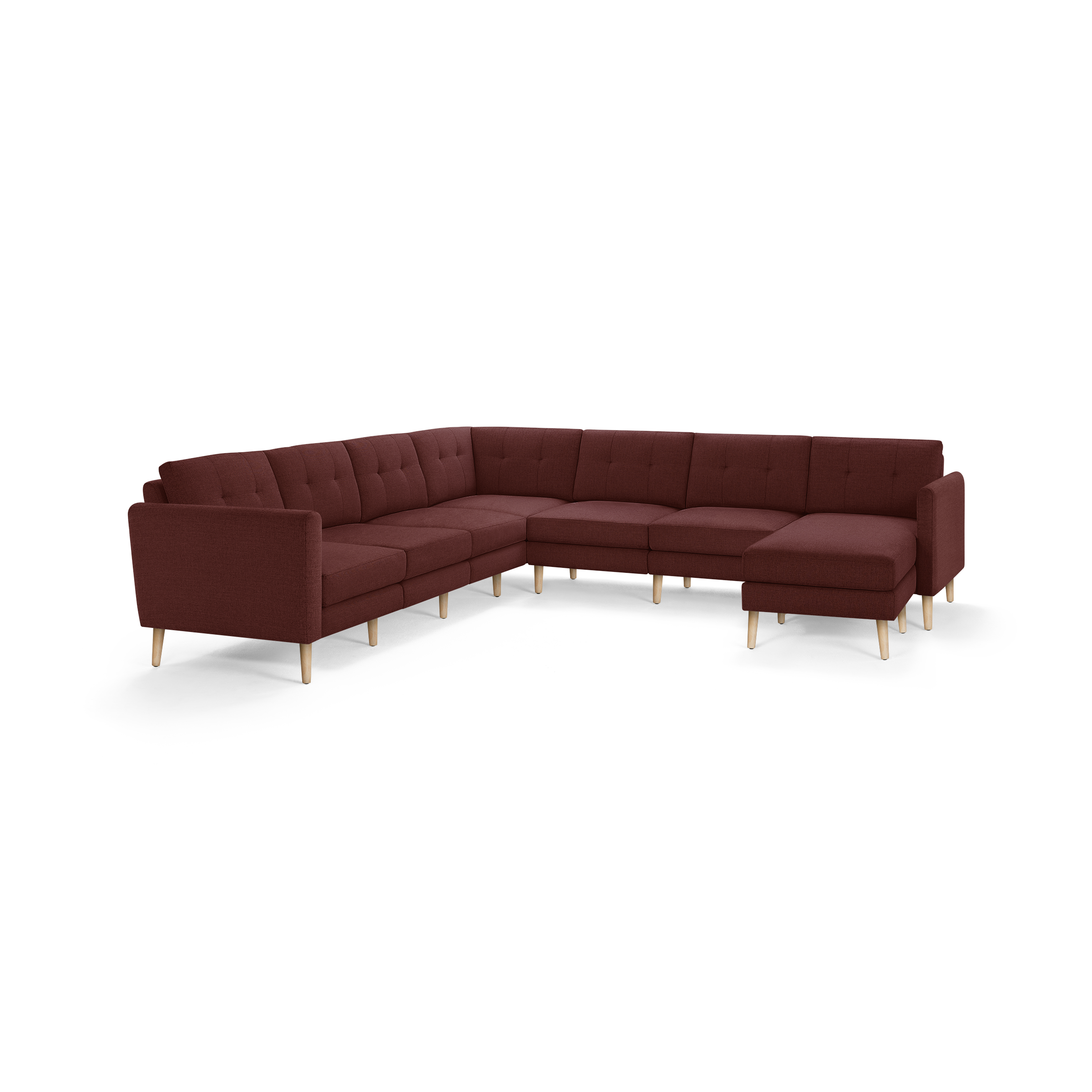 Large L-shaped sectional sofa with deep red fabric upholstery, tufted back cushions, and light wooden legs.