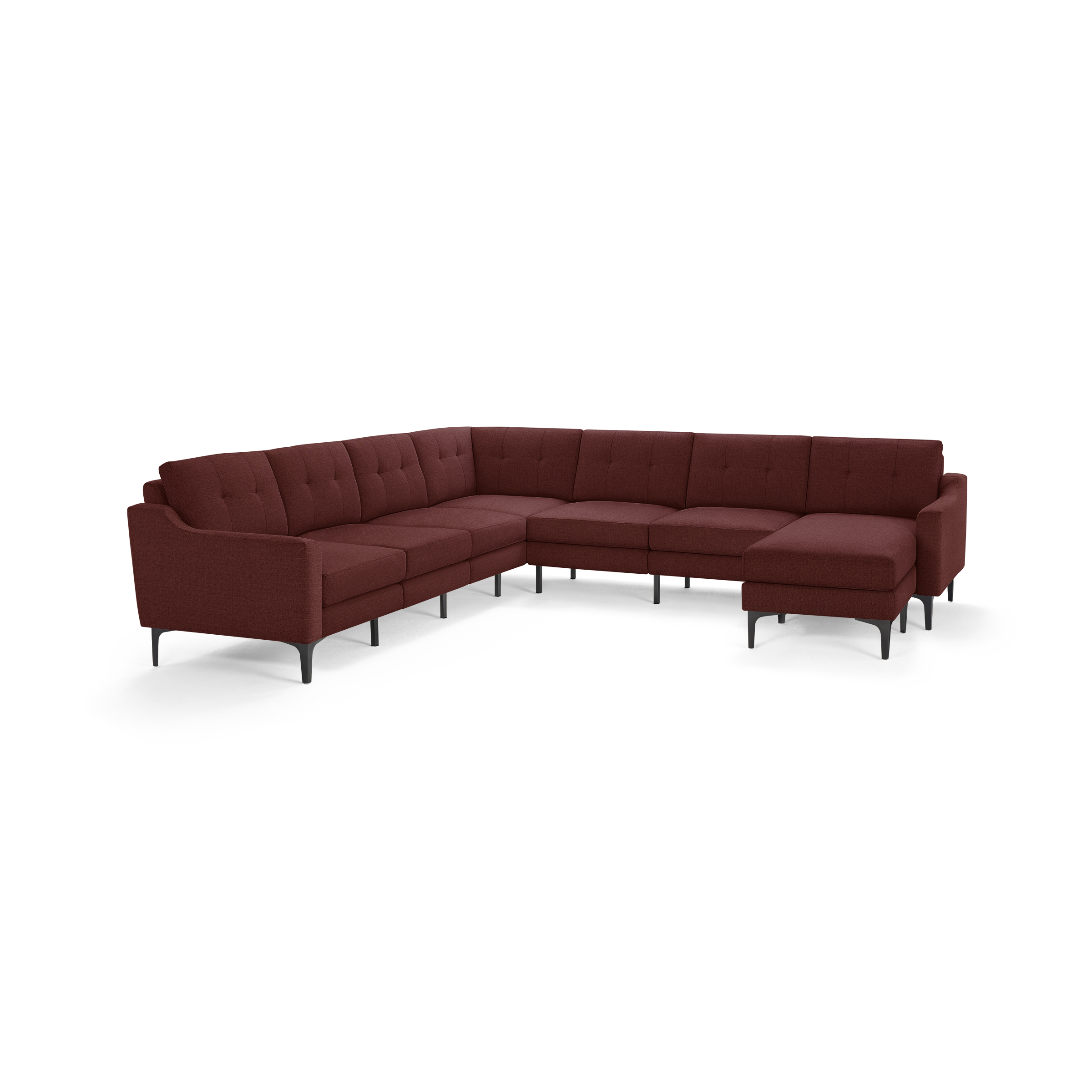 Large L-shaped sectional sofa with deep red fabric upholstery, tufted back cushions, and slender black metal legs.