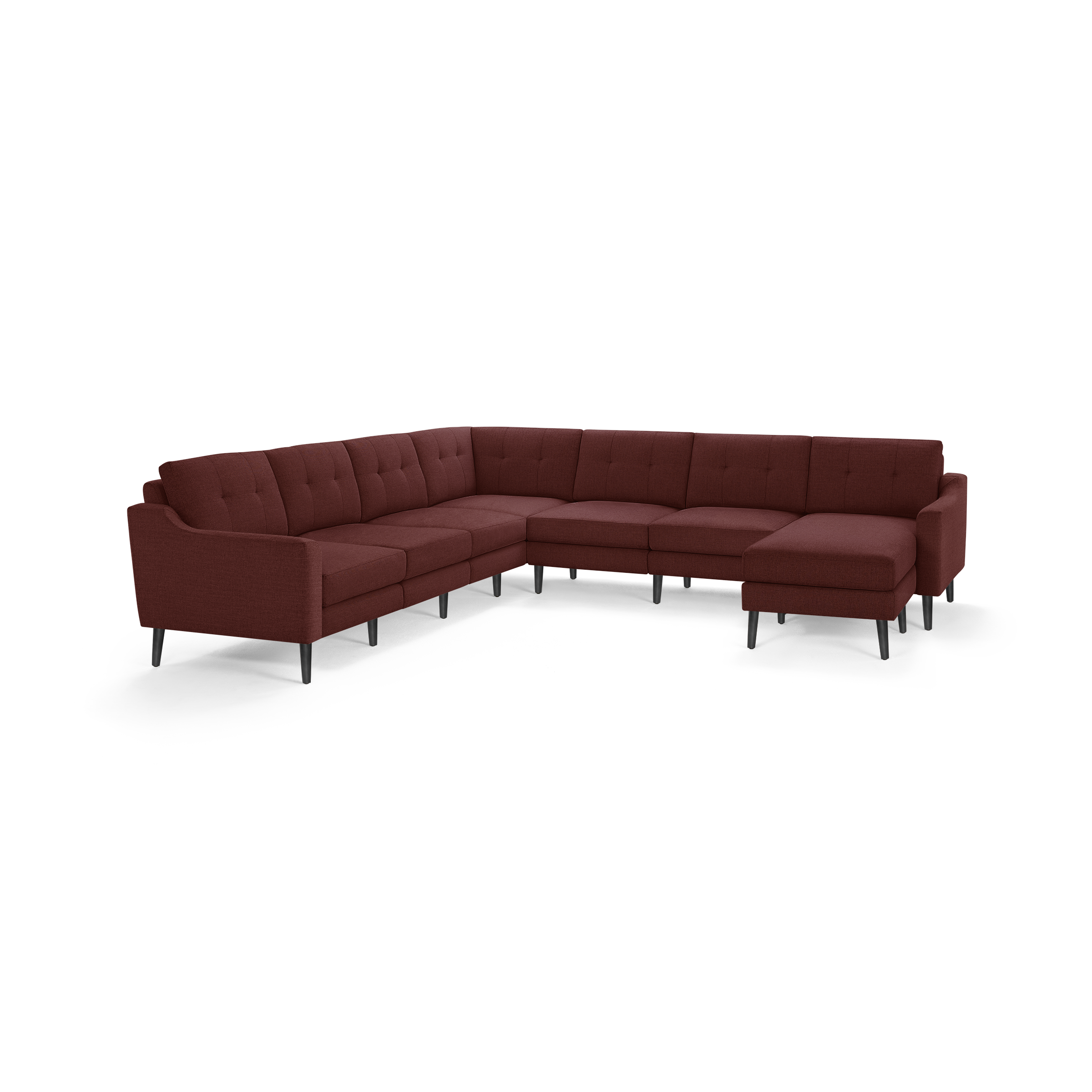 Large L-shaped sectional sofa in deep red fabric with tufted back cushions and slim black legs, modern design.