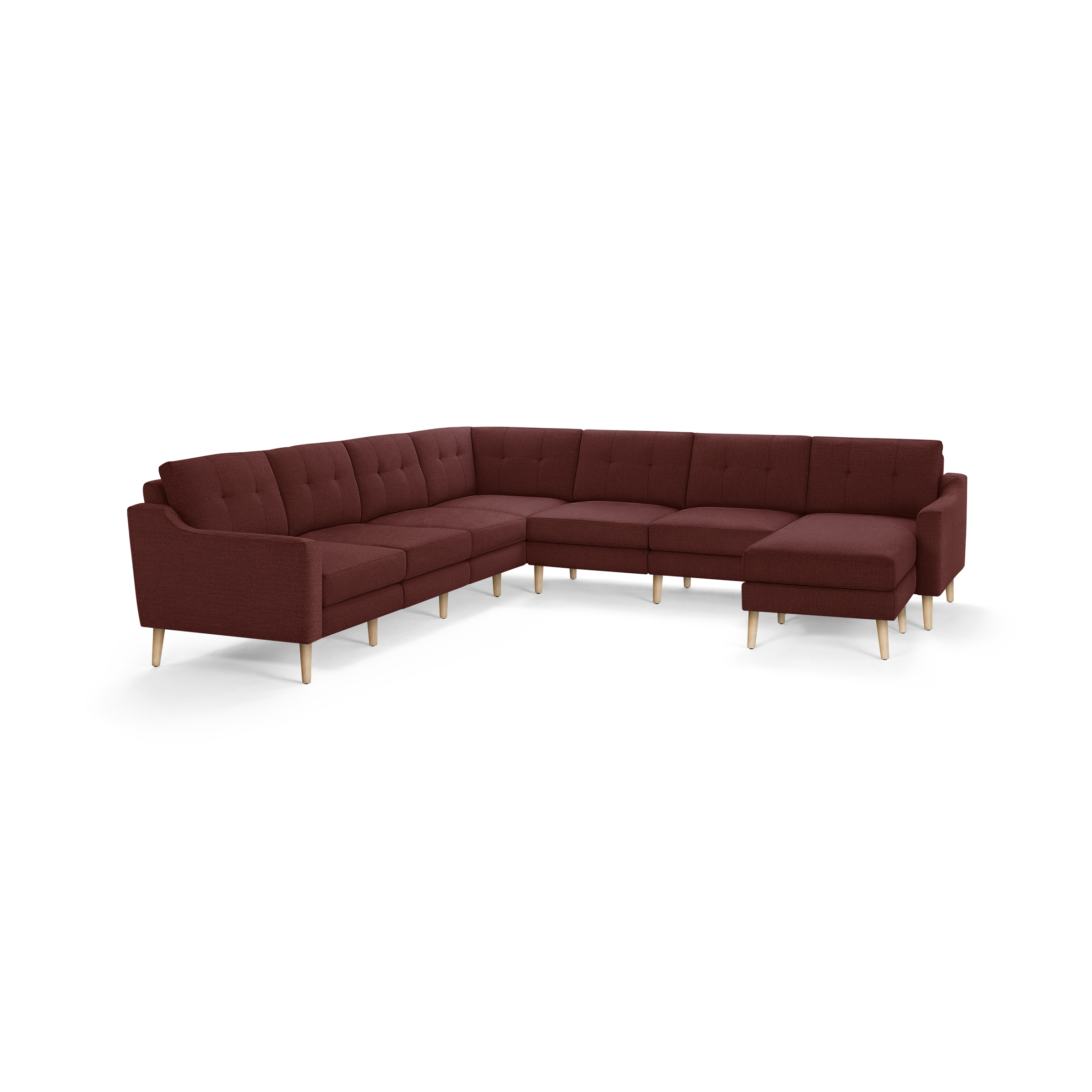 Large L-shaped sectional sofa in deep red fabric with tufted cushions and light wooden legs, featuring a right-side chaise lounge.
