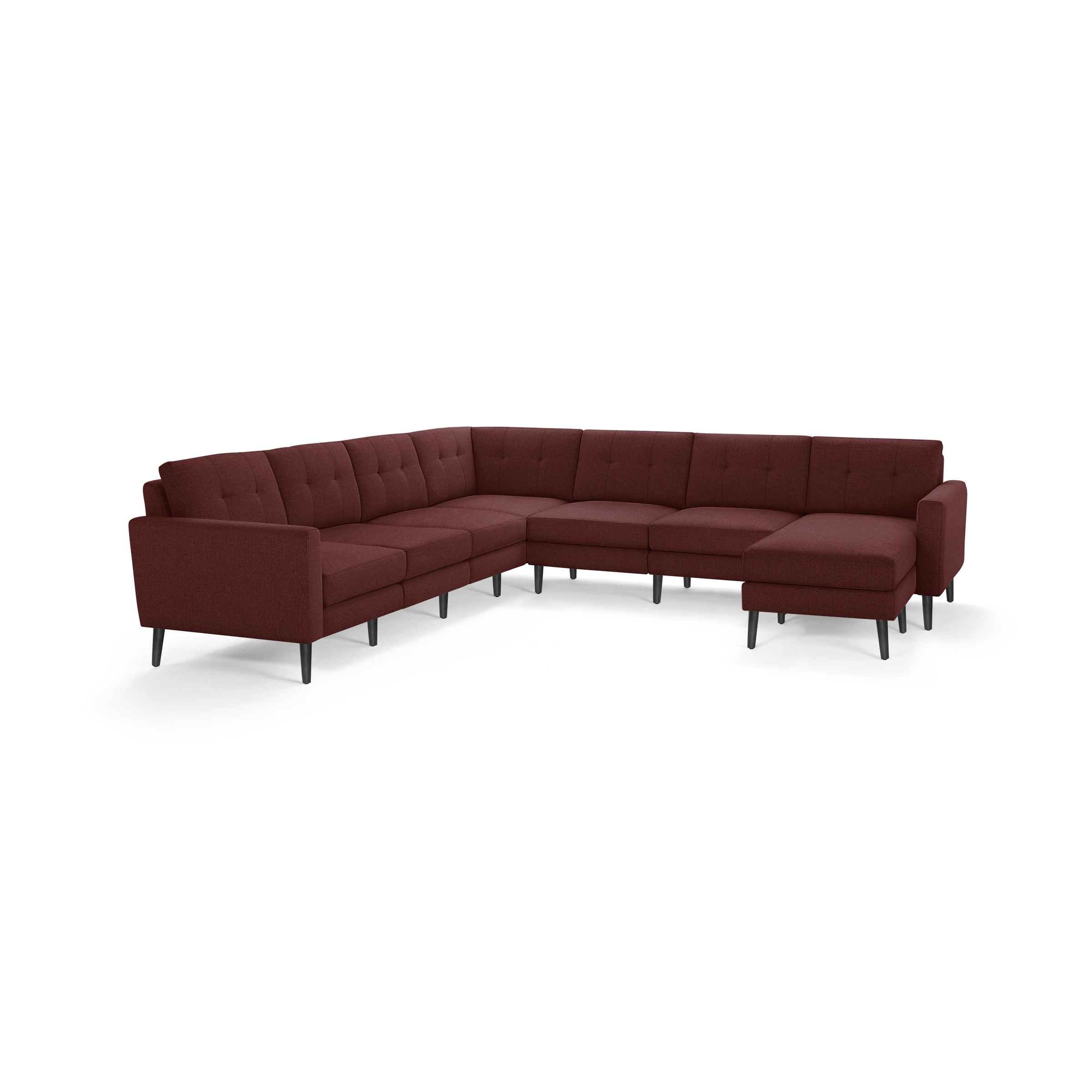 Large modern L-shaped sectional sofa in deep burgundy fabric with tufted back cushions and black tapered legs.