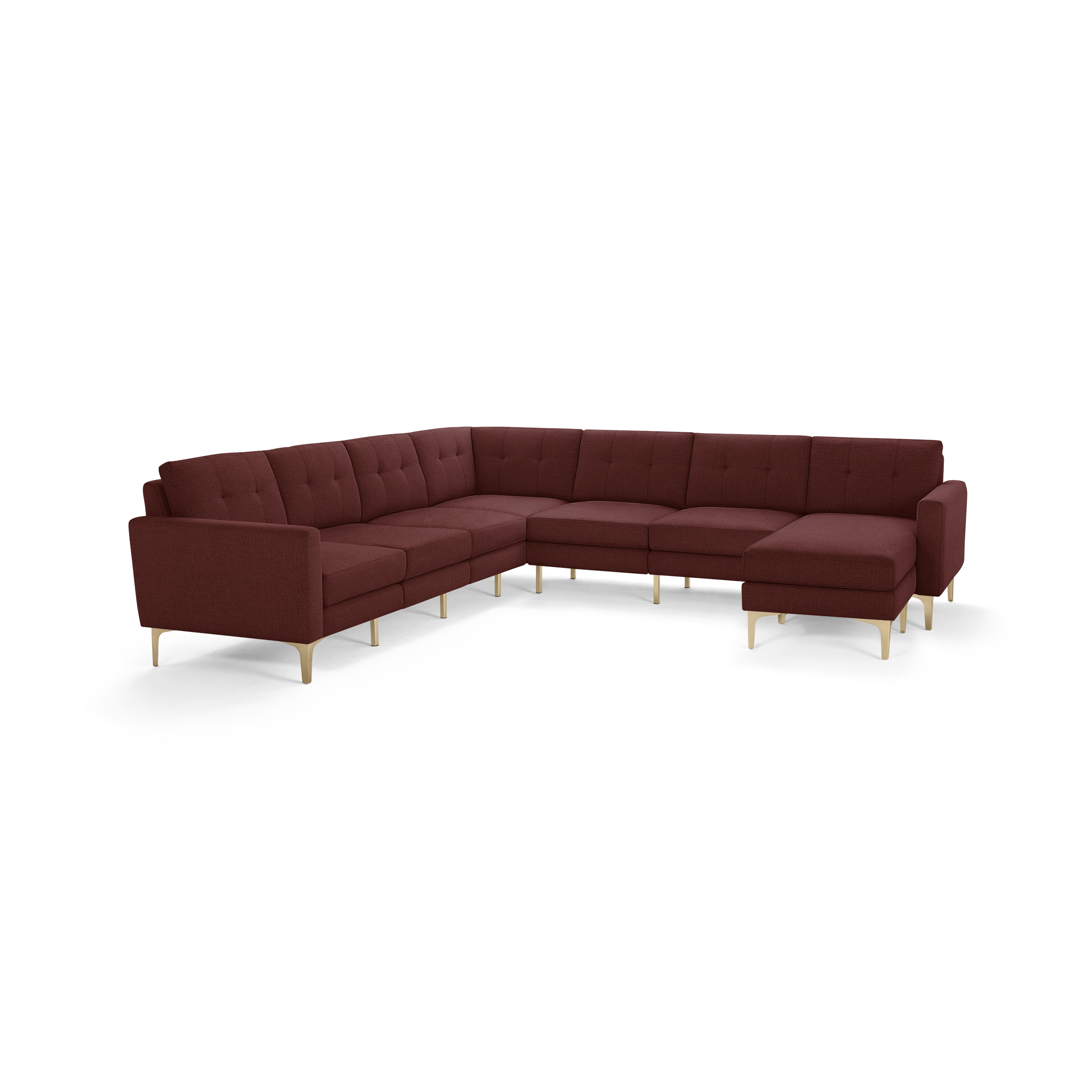 Large L-shaped sectional sofa upholstered in deep red fabric with button-tufted back cushions and light wood legs.