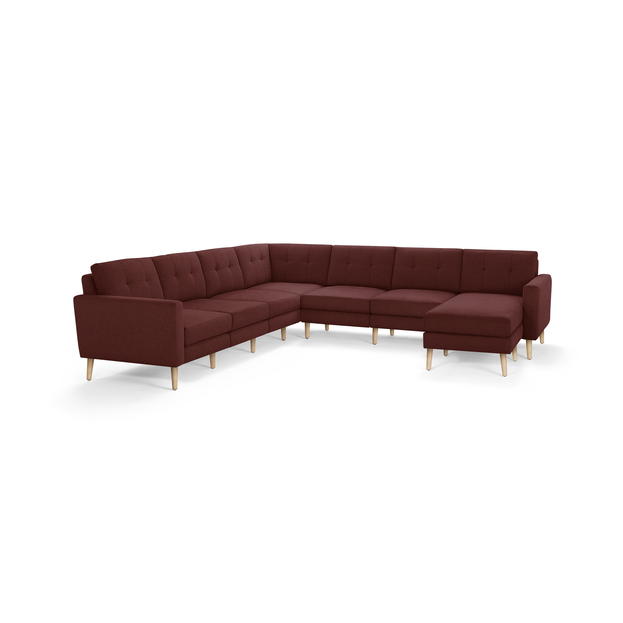 Large L-shaped sectional sofa in deep red upholstery with button-tufted cushions and light wooden legs, featuring a right-side chaise lounge.