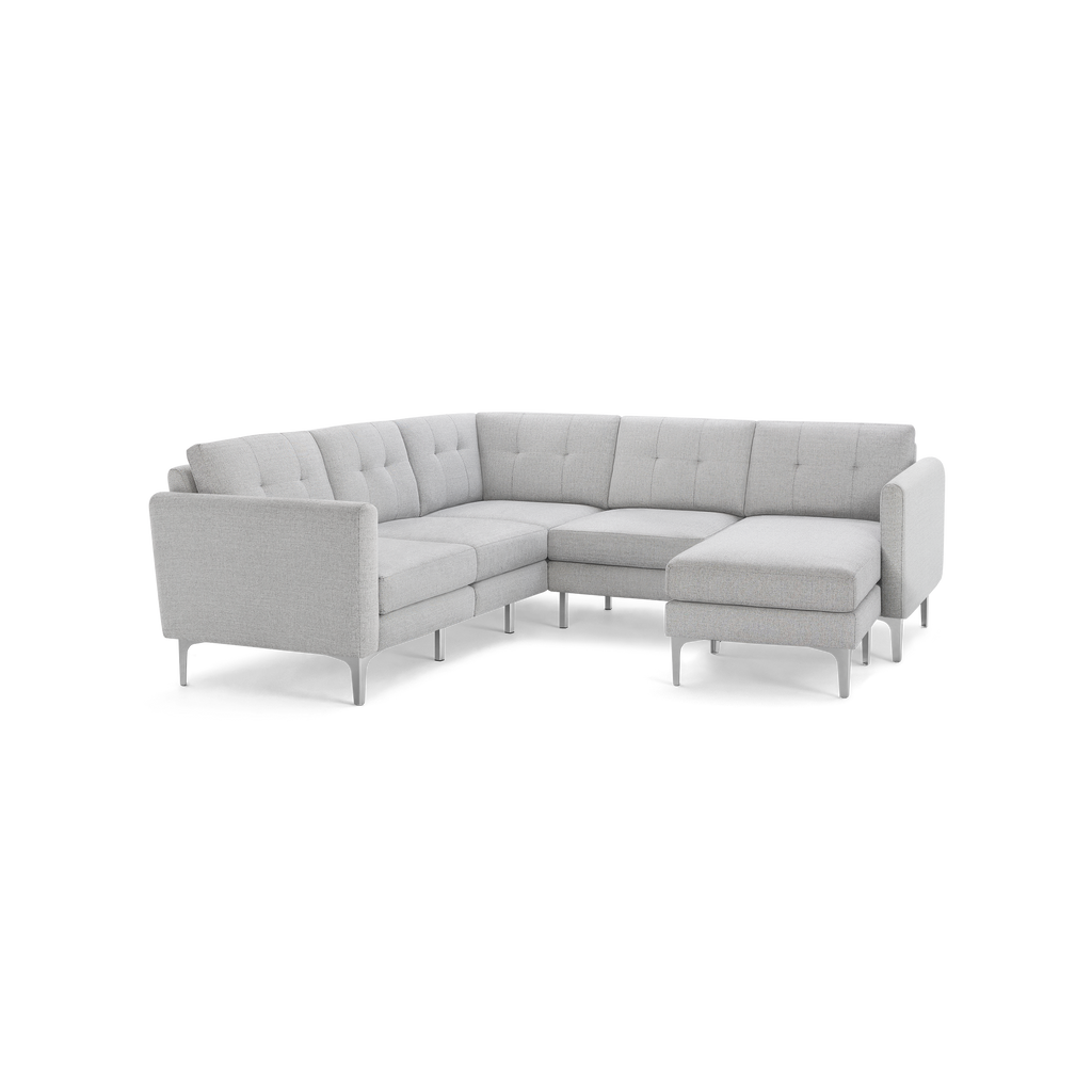 Modern light gray fabric L-shaped sectional sofa with tufted back cushions and metal legs, designed for corner seating.