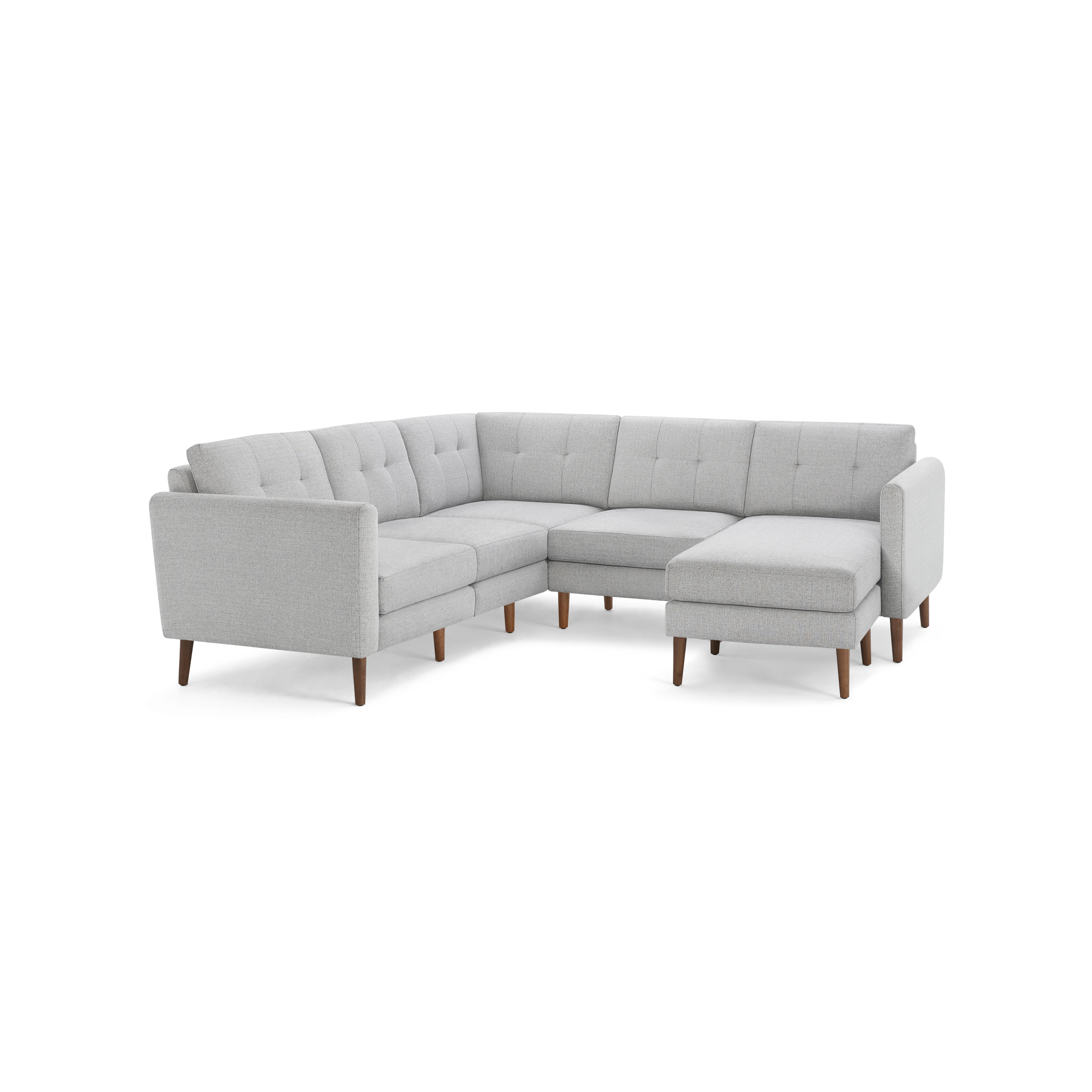 Light gray upholstered sectional sofa with tufted cushions and wooden legs, featuring a right-side chaise lounge.