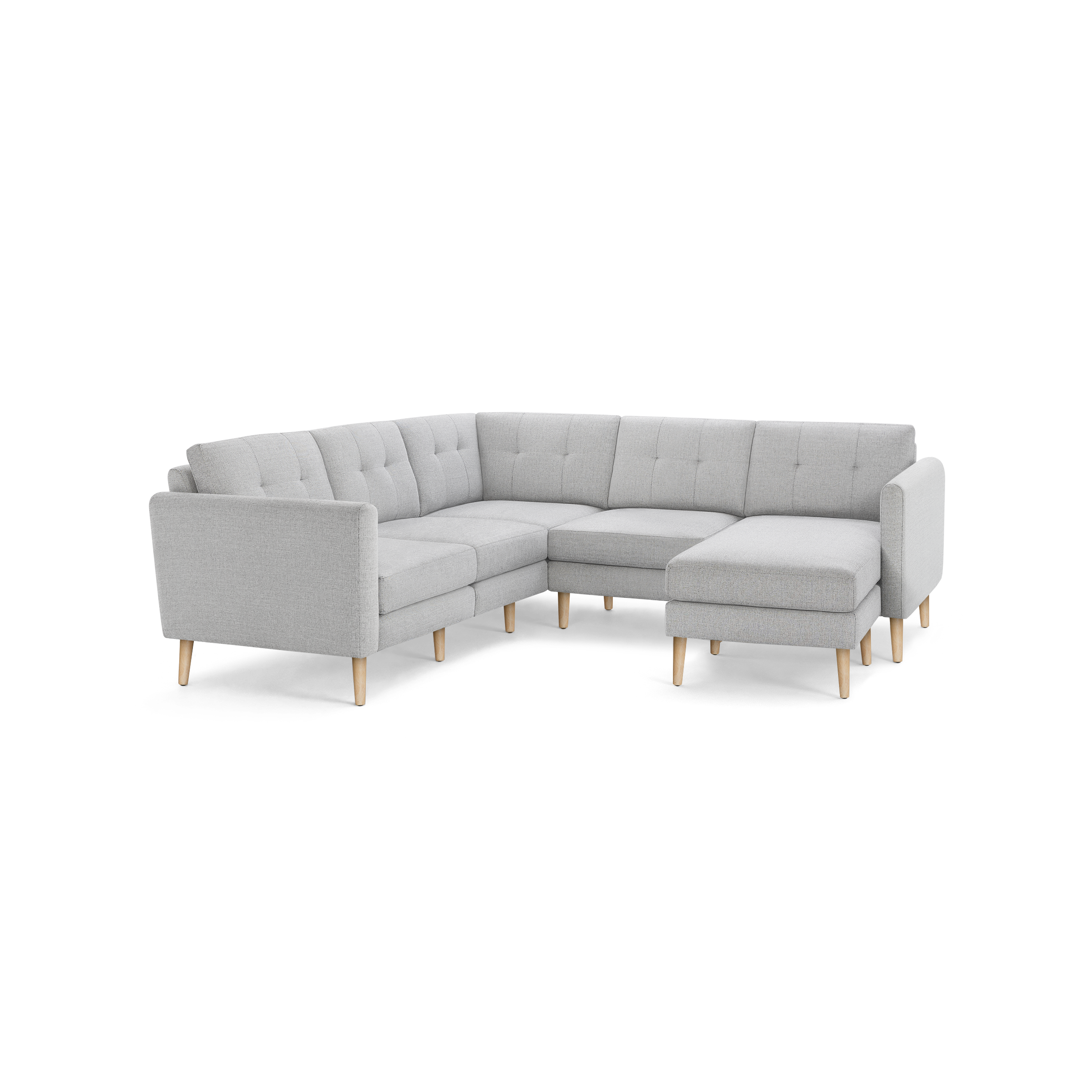 Light gray fabric sectional sofa with tufted back cushions and wooden tapered legs, featuring a right-side chaise lounge.