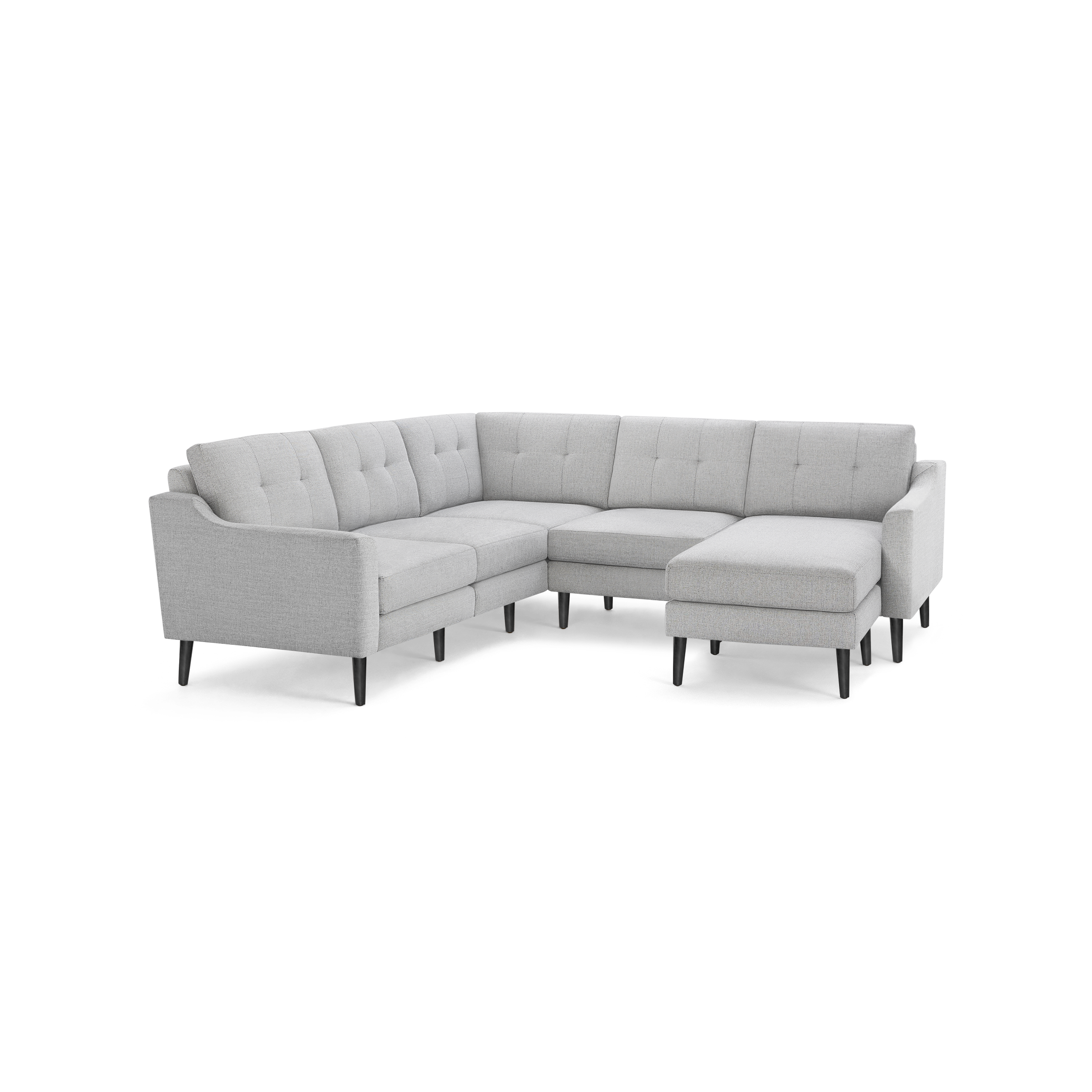 Light gray upholstered L-shaped sectional sofa with tufted back cushions and dark wooden legs, featuring a chaise lounge on one end.