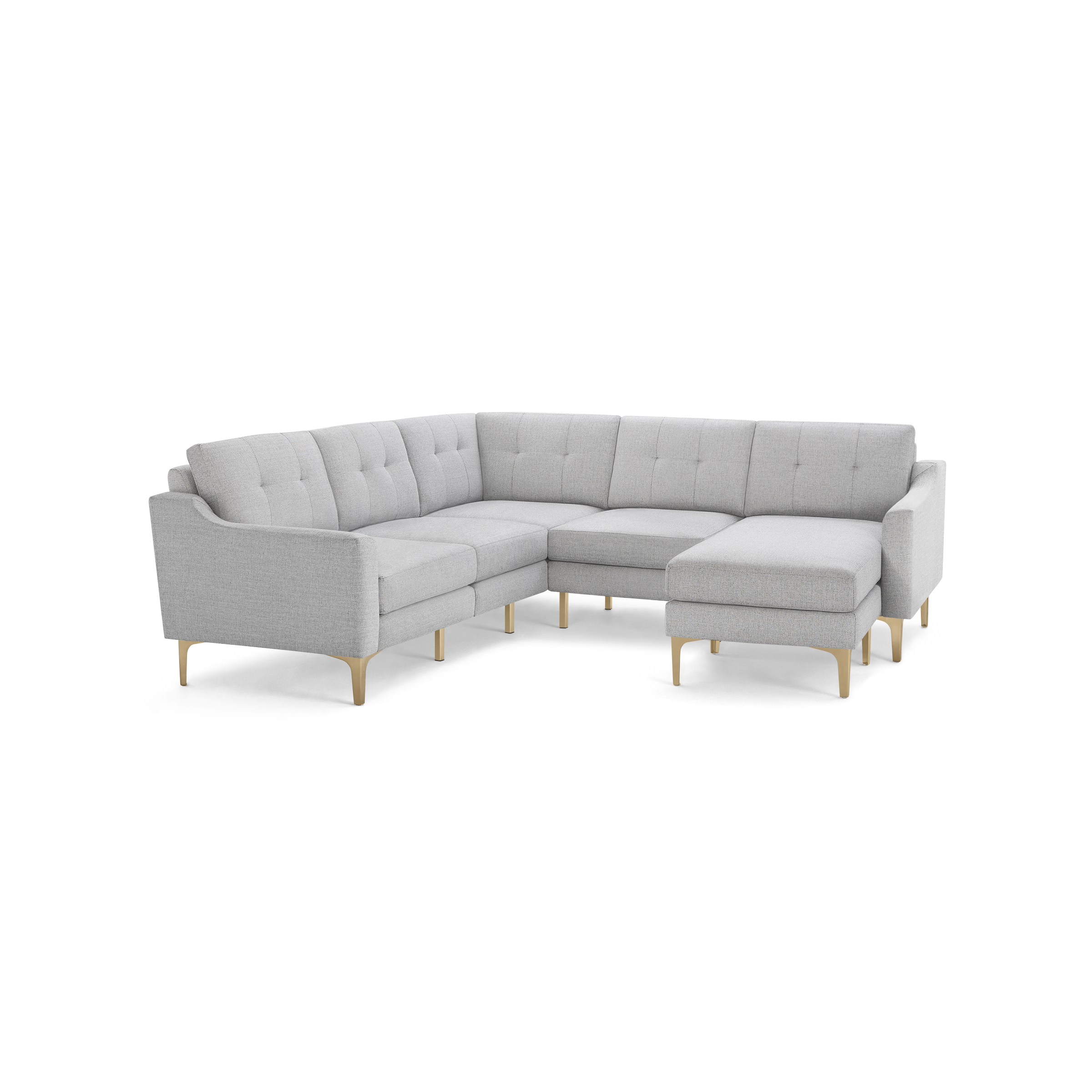 Light gray fabric L-shaped sectional sofa with tufted back cushions and light wooden angled legs.