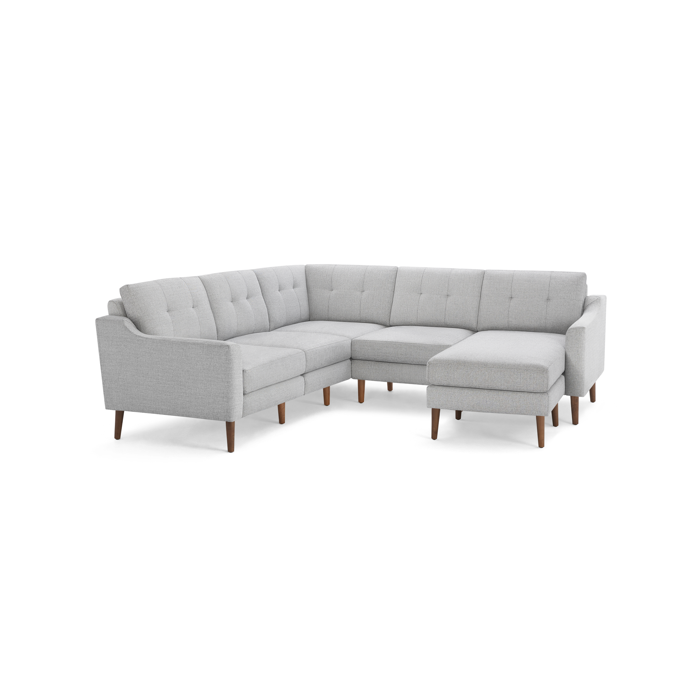 Light gray L-shaped sectional sofa with tufted cushions and mid-century modern wooden legs, featuring a chaise lounge on the right side.