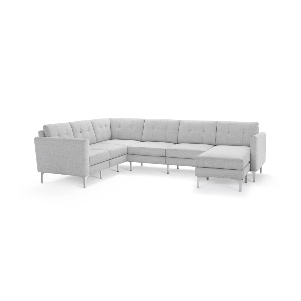 Light gray L-shaped sectional sofa with tufted back cushions and slim metal legs on a white background.