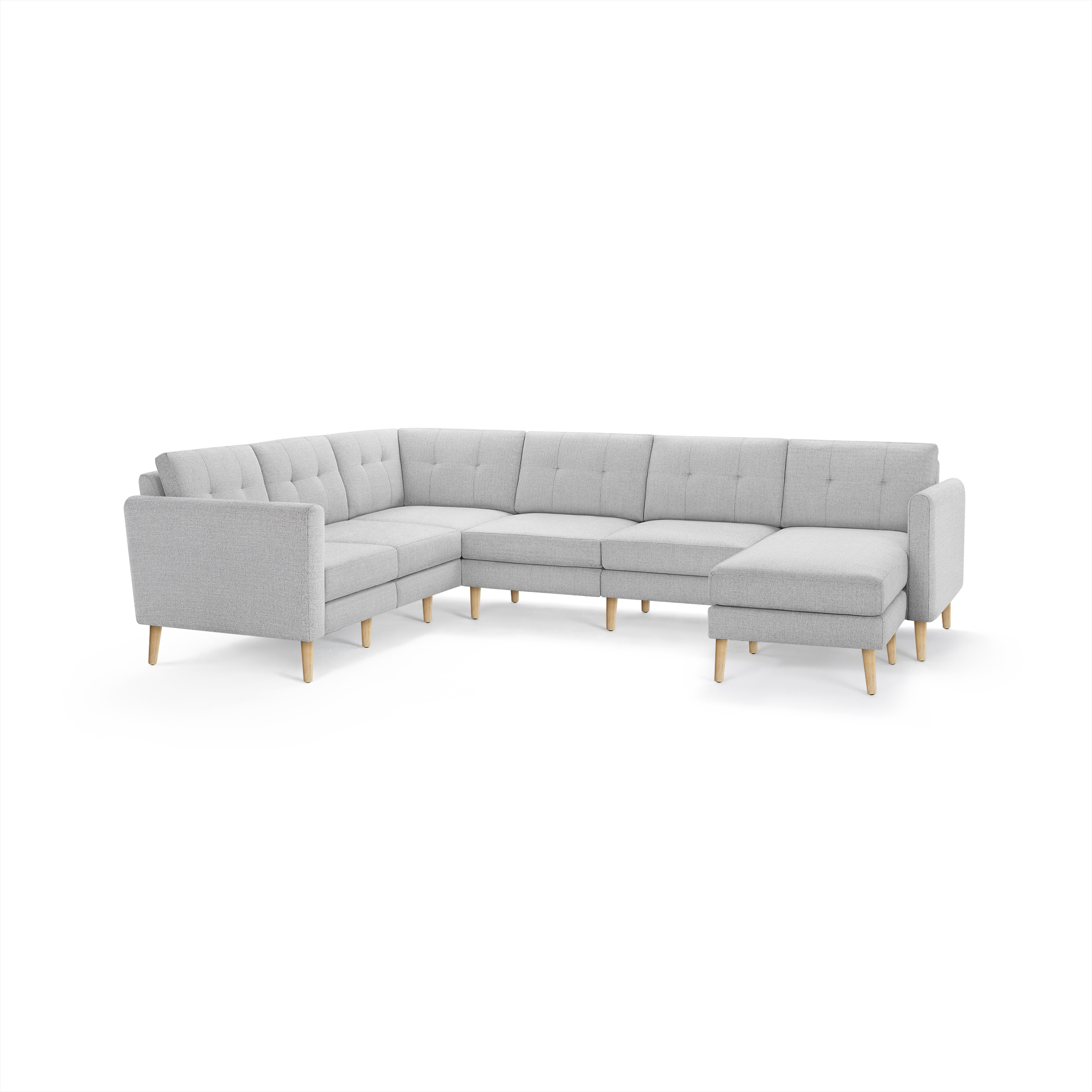 Light gray modern L-shaped sectional sofa with tufted back cushions and wooden angled legs, designed for spacious seating.