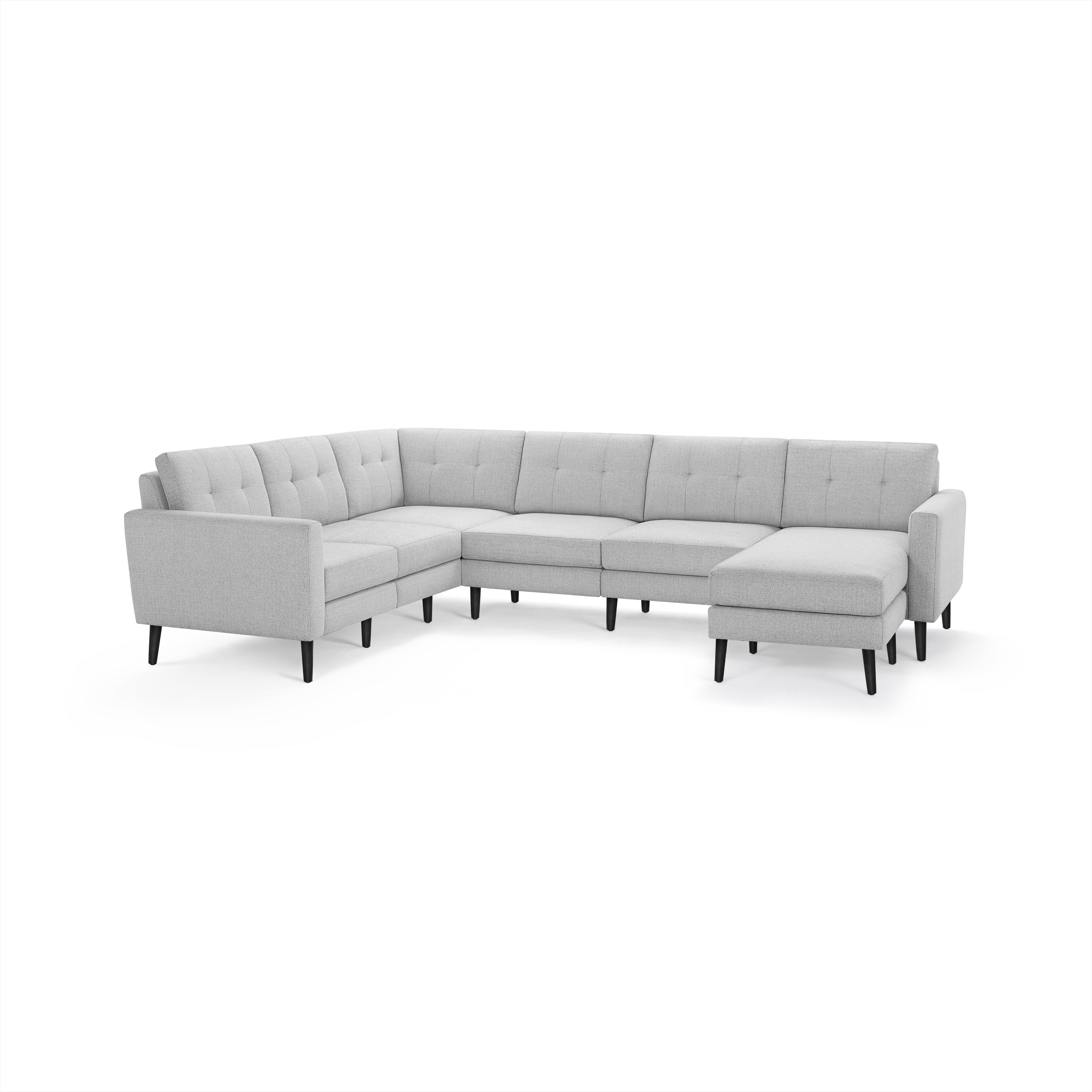 Light gray upholstered modern sectional sofa with button-tufted back cushions, black tapered legs, and an L-shaped design with chaise lounge.