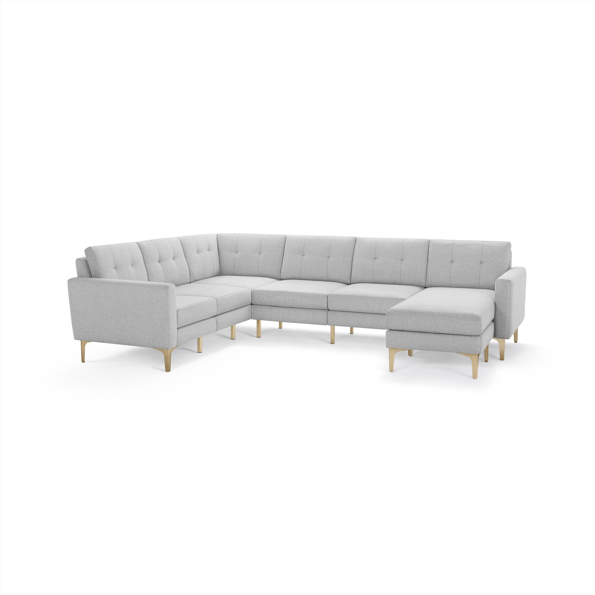 Light gray modern sectional sofa with tufted cushions, wooden legs, and an extended chaise lounge on the right side.