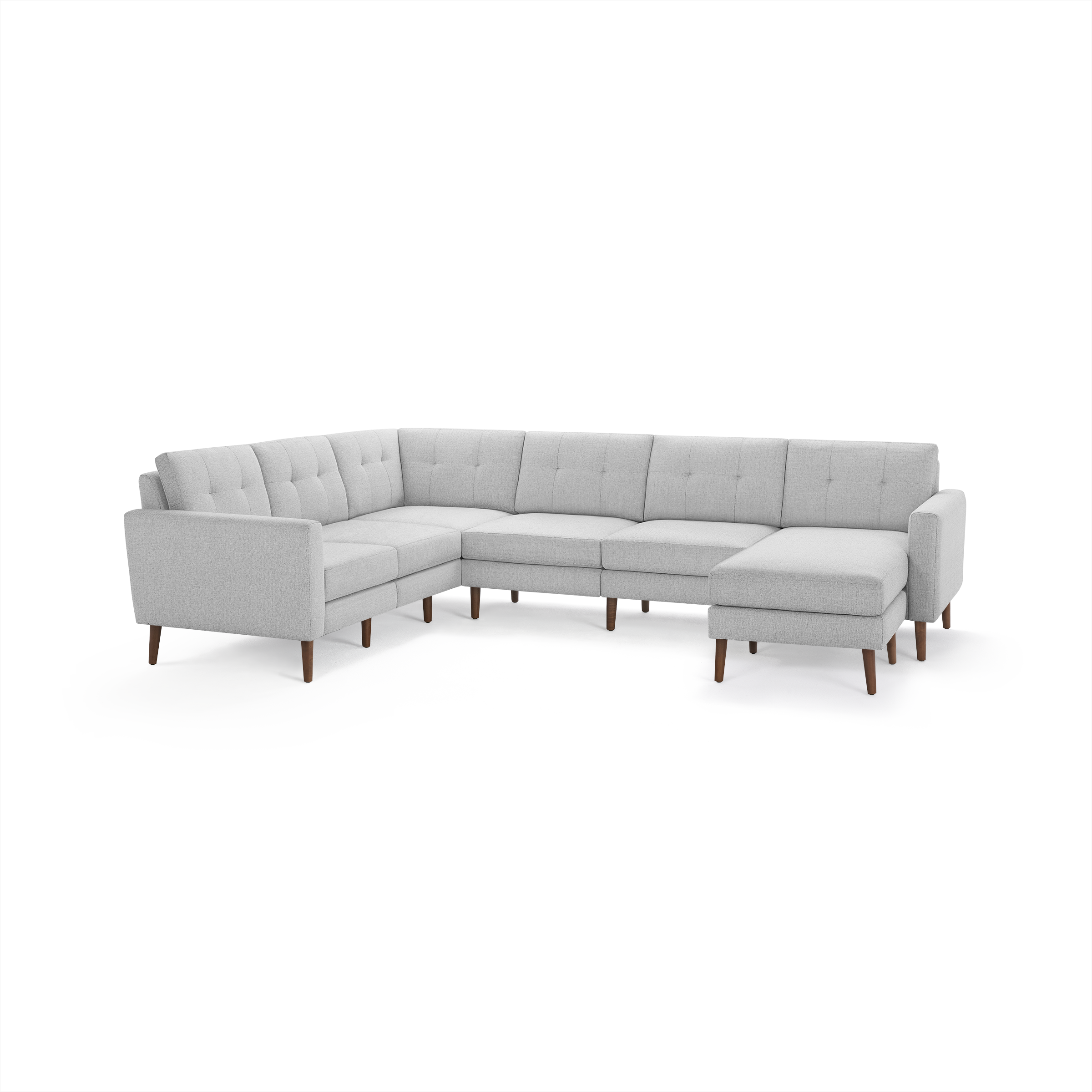 Light gray fabric sectional sofa with tufted cushions, wooden legs, and a right-side chaise lounge.