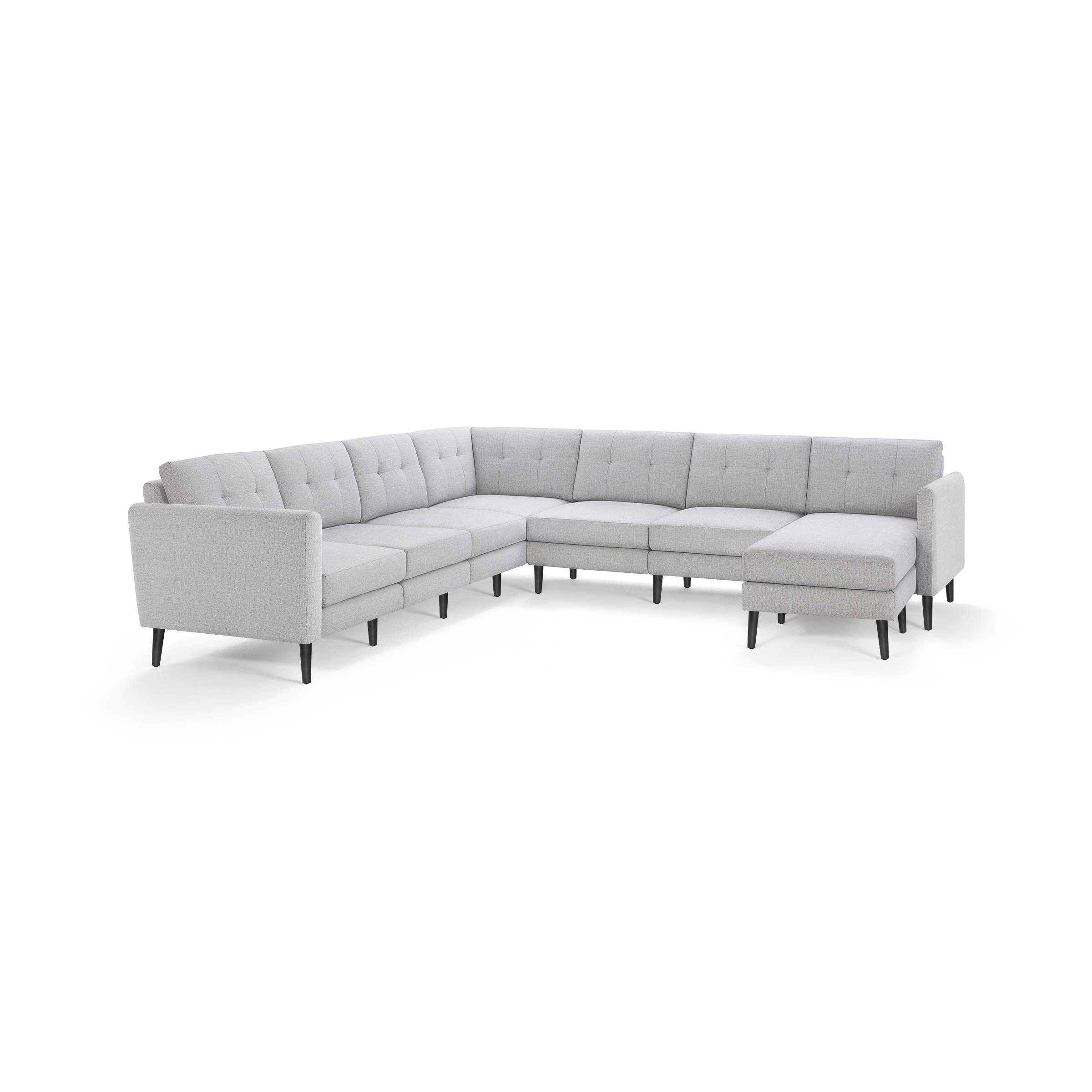 Light gray upholstered L-shaped sectional sofa with tufted back cushions and black tapered legs.