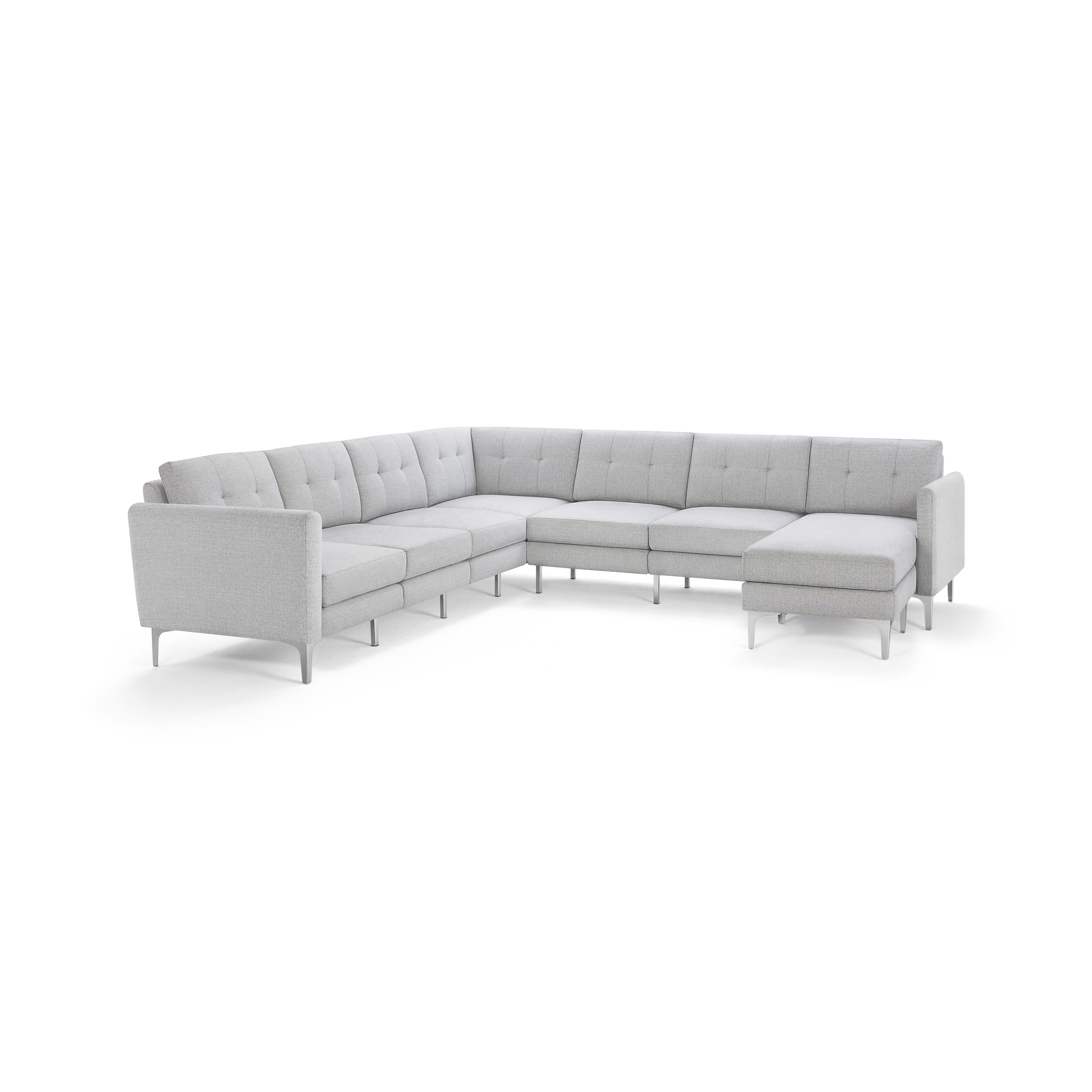 Light gray L-shaped sectional sofa with tufted back cushions and slim angled legs, featuring a chaise lounge on the right side.