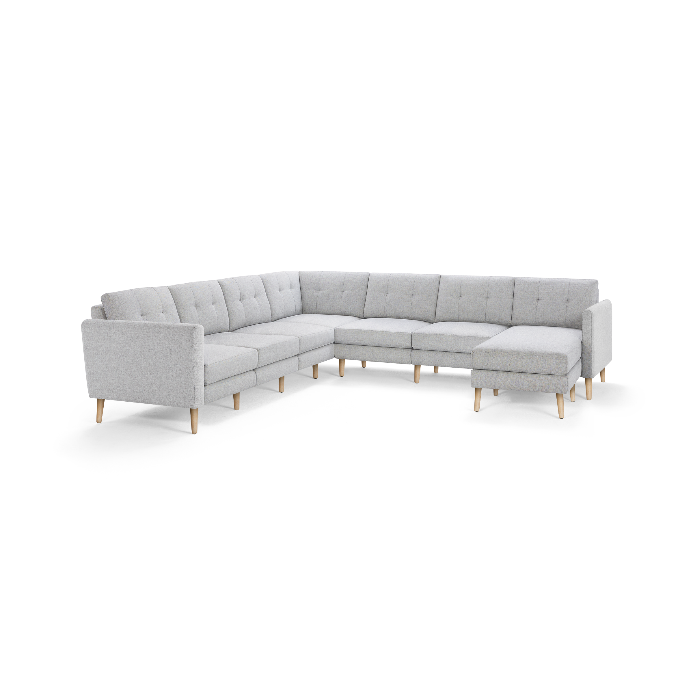 Light gray L-shaped sectional sofa with tufted back cushions and light wooden legs, offering modern and spacious seating.