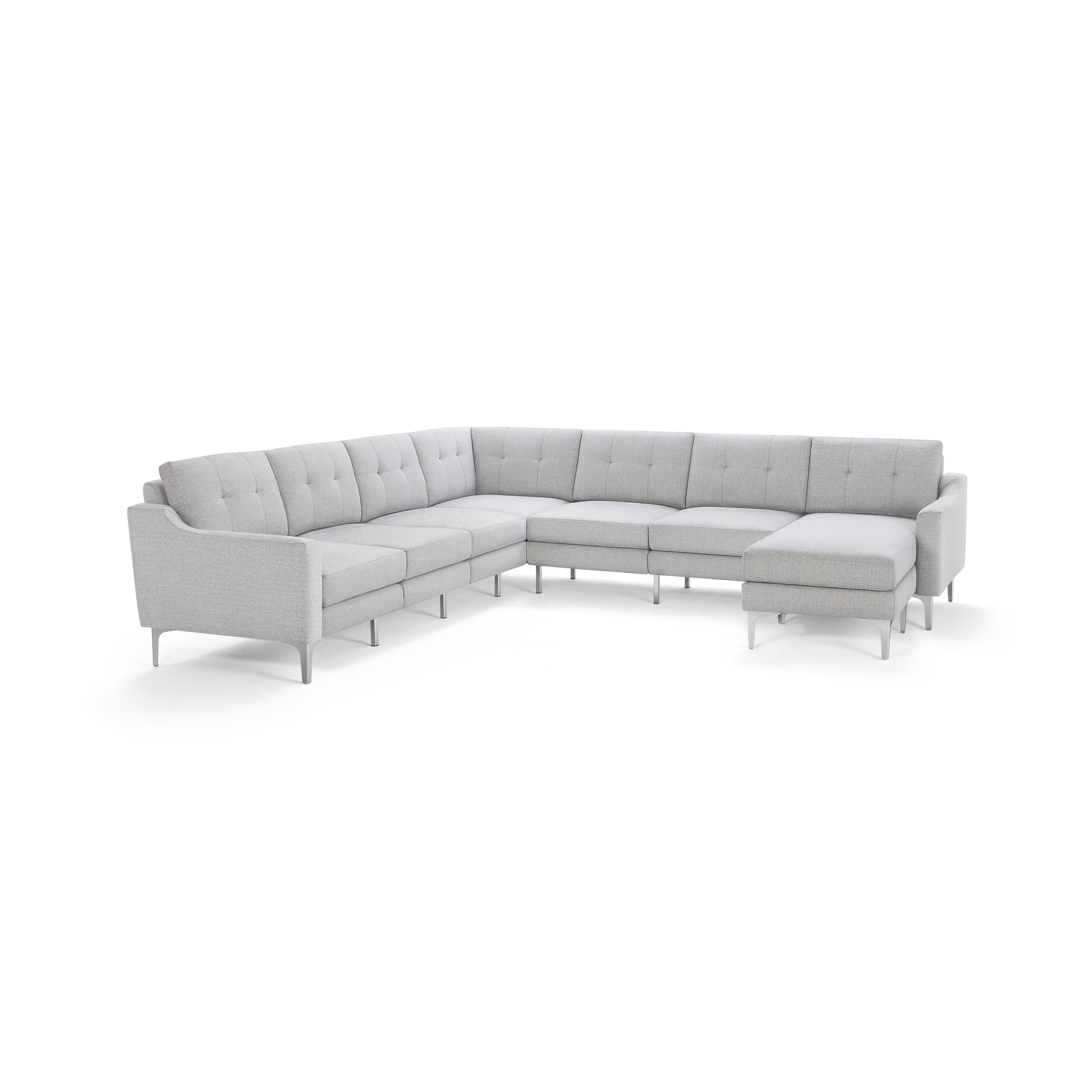 Light gray L-shaped sectional sofa with tufted back cushions, metal legs, and a chaise lounge on the right side.