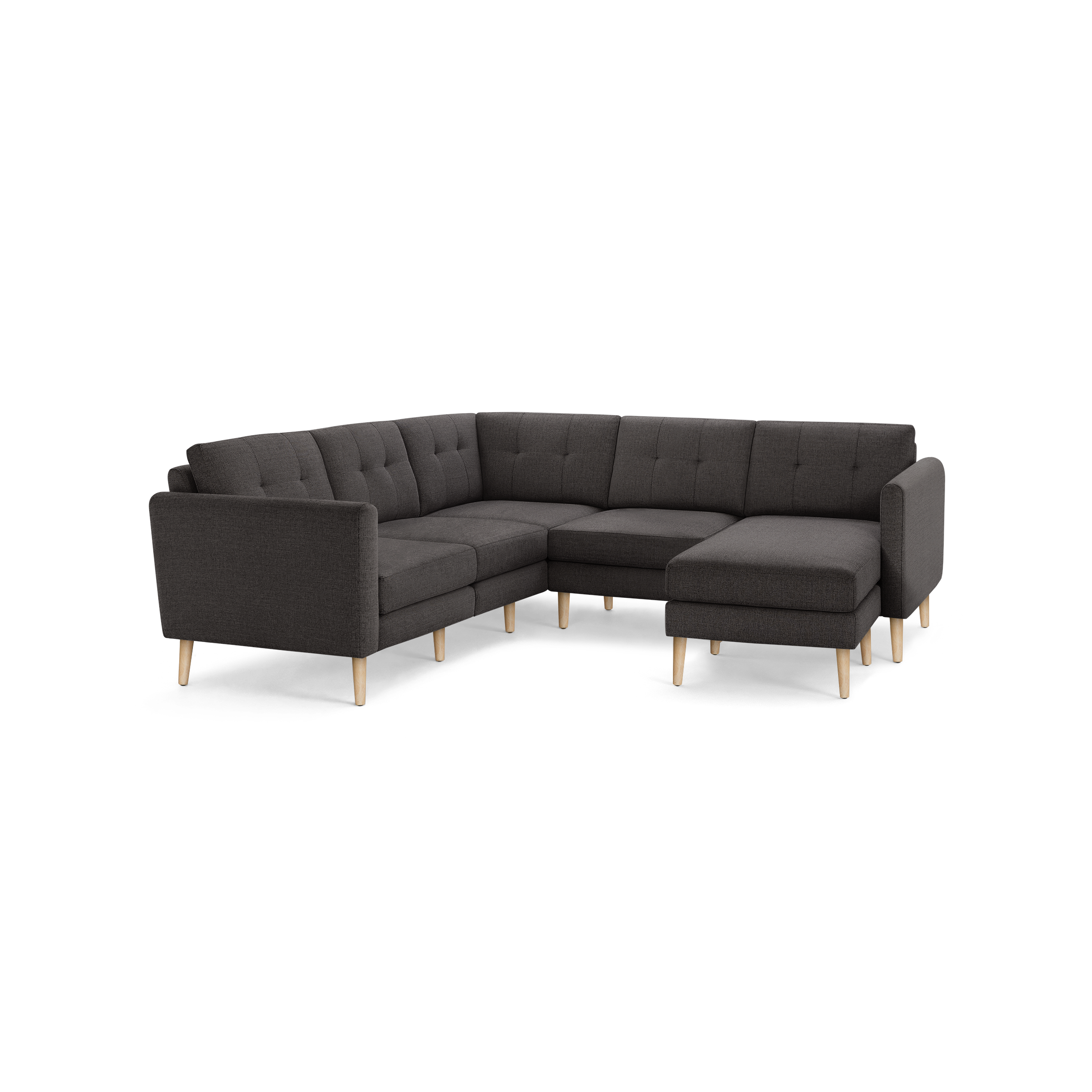 Dark gray L-shaped sectional sofa with tufted cushions and light wood legs, featuring a right-side chaise lounge.