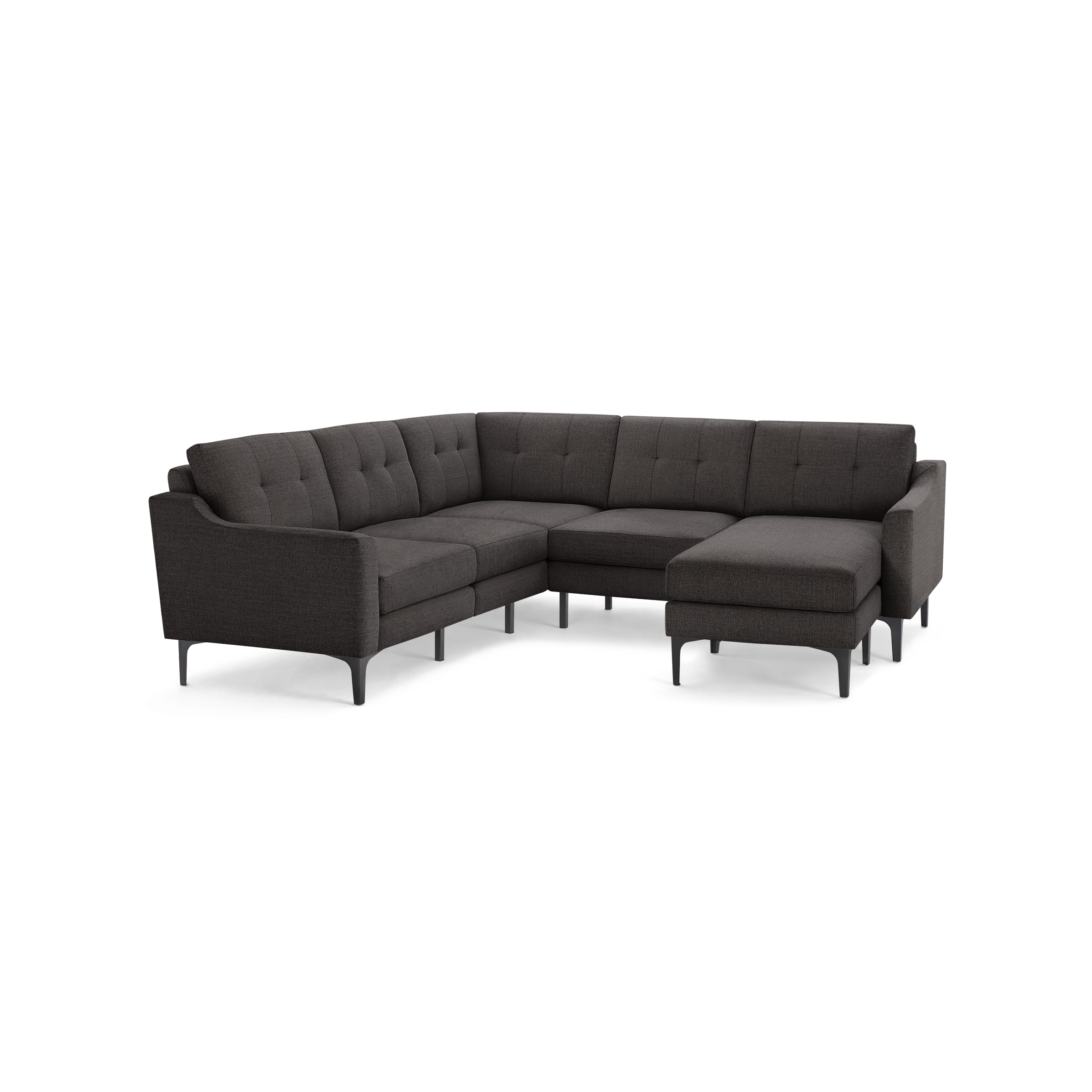 Dark gray L-shaped sectional sofa with tufted back cushions and slim black legs, featuring a chaise lounge on the right side.