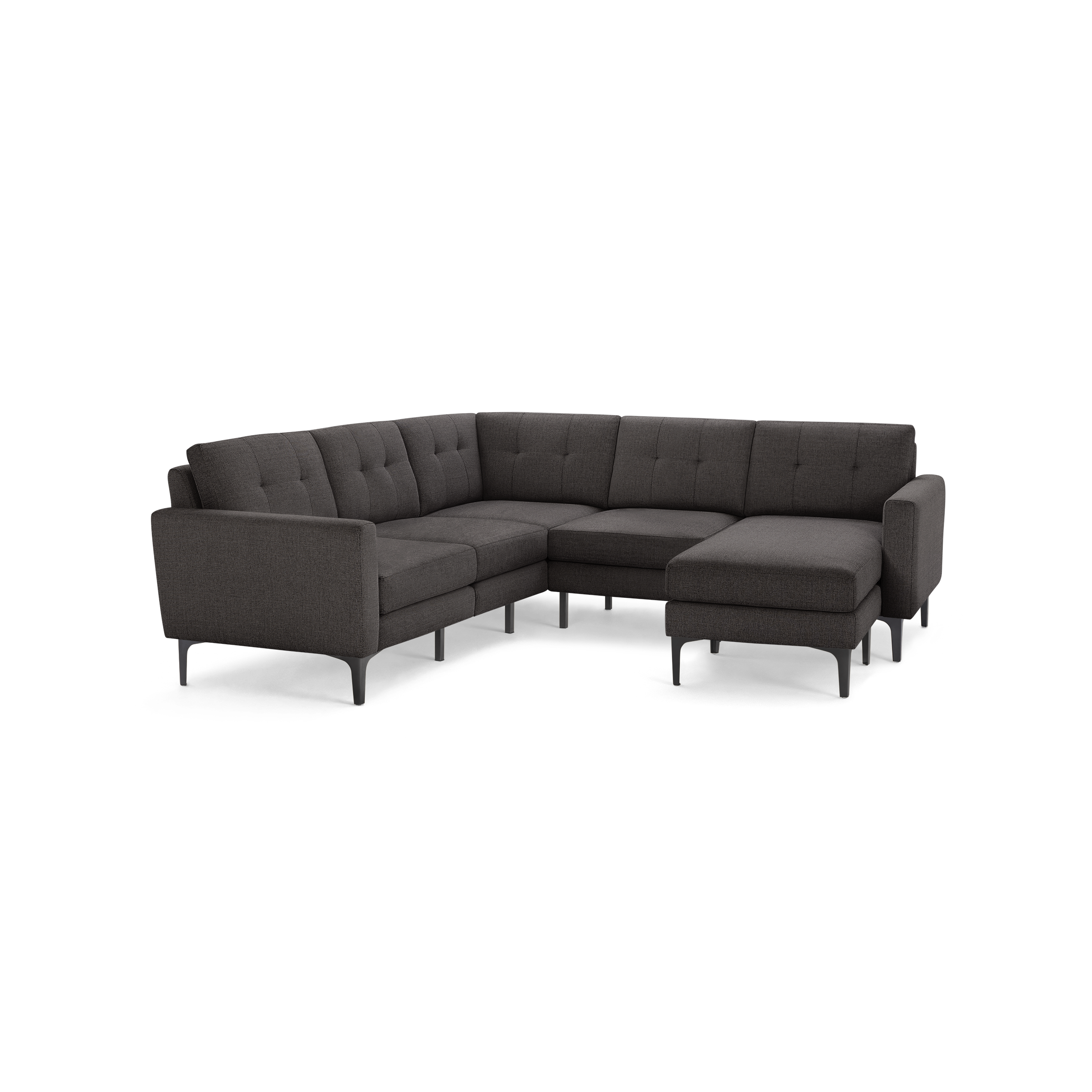 Dark gray upholstered sectional sofa with tufted cushions, modern metal legs, and chaise lounge on the right side.