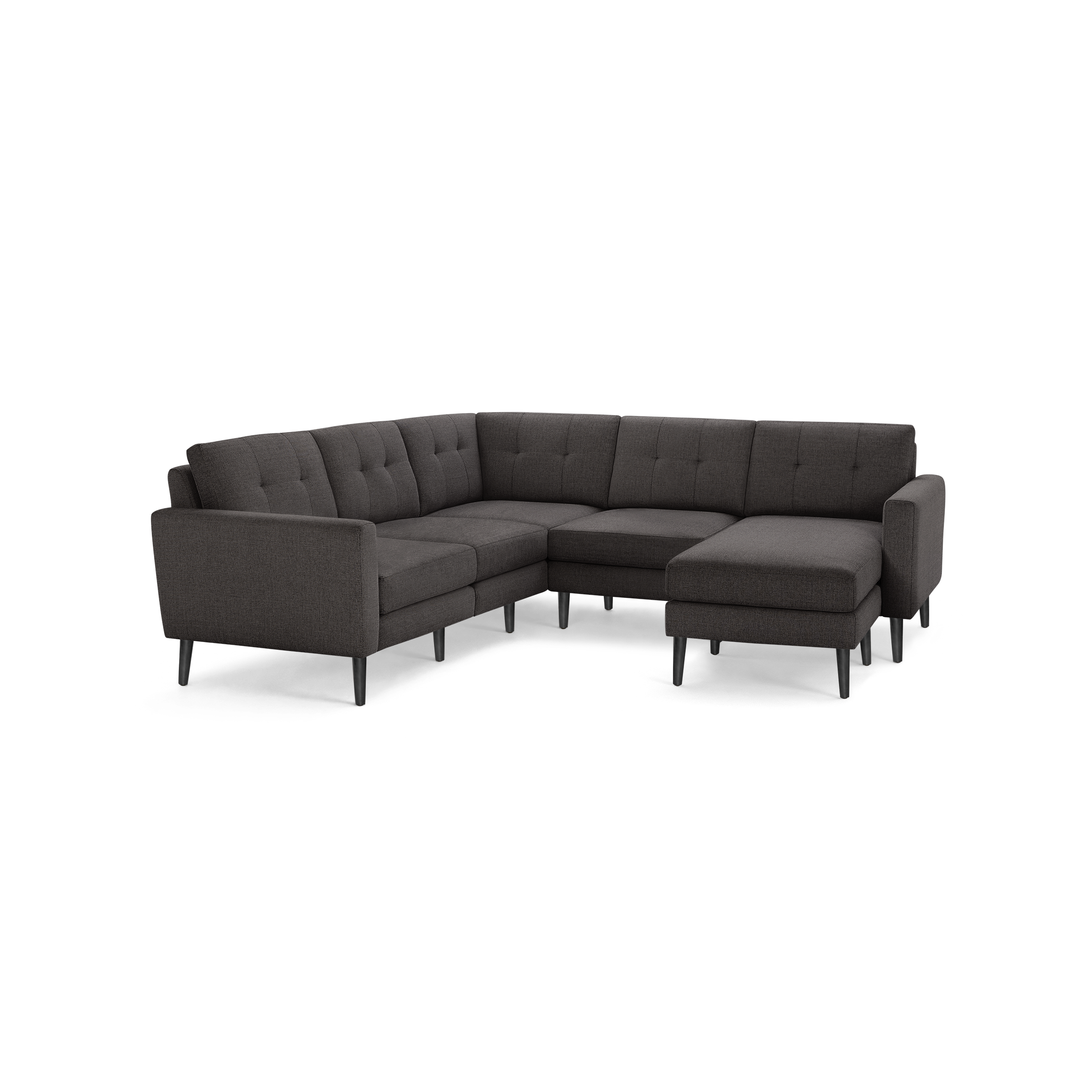 Dark gray upholstered L-shaped sectional sofa with tufted cushions and black tapered wooden legs.