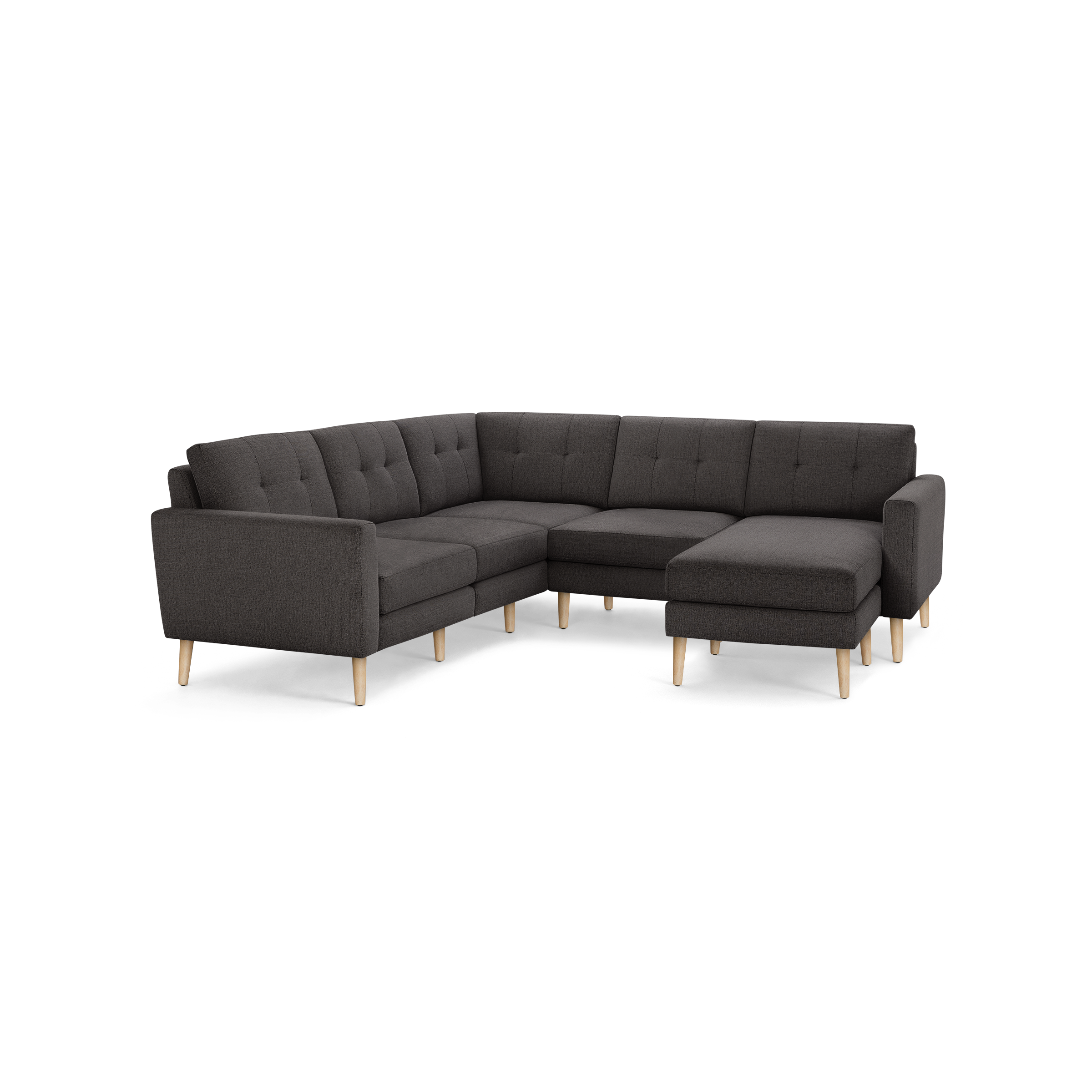 Dark gray L-shaped sectional sofa with tufted backrest, wooden legs, and a modern minimalist design.