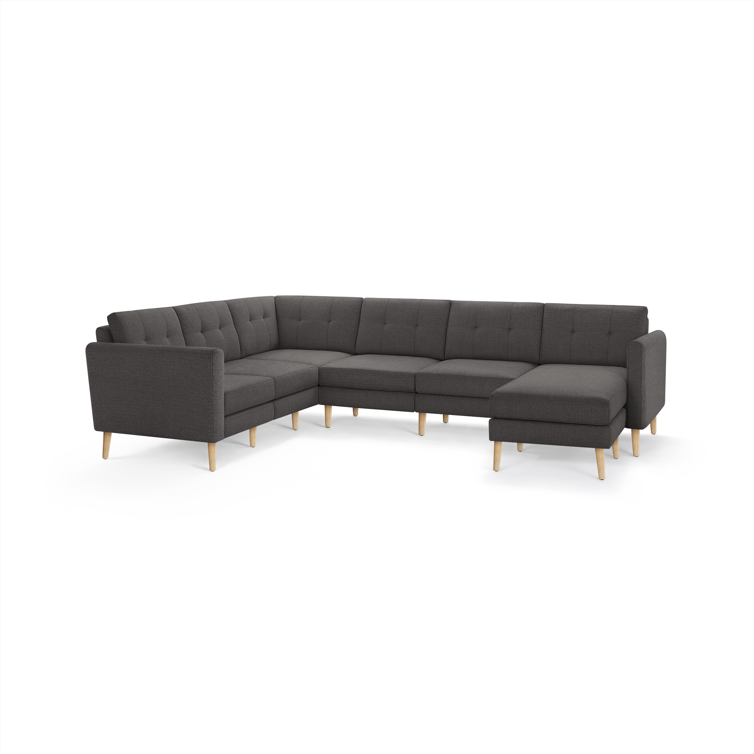 Dark gray fabric L-shaped sectional sofa with tufted cushions and light wooden legs.